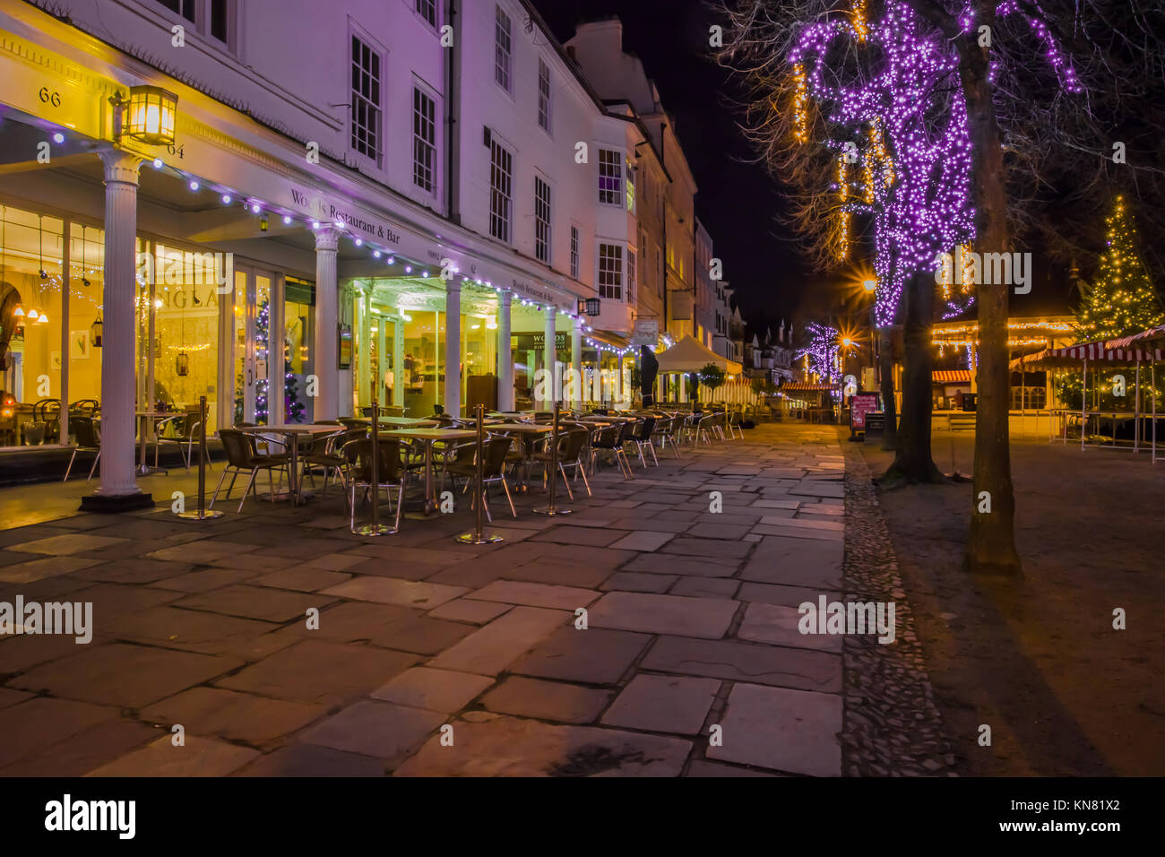 Royal Tunbridge Wells The Pantiles pedestrianised colonnade Dusk evening dark with shop lights and Christmas lights Stock Photo