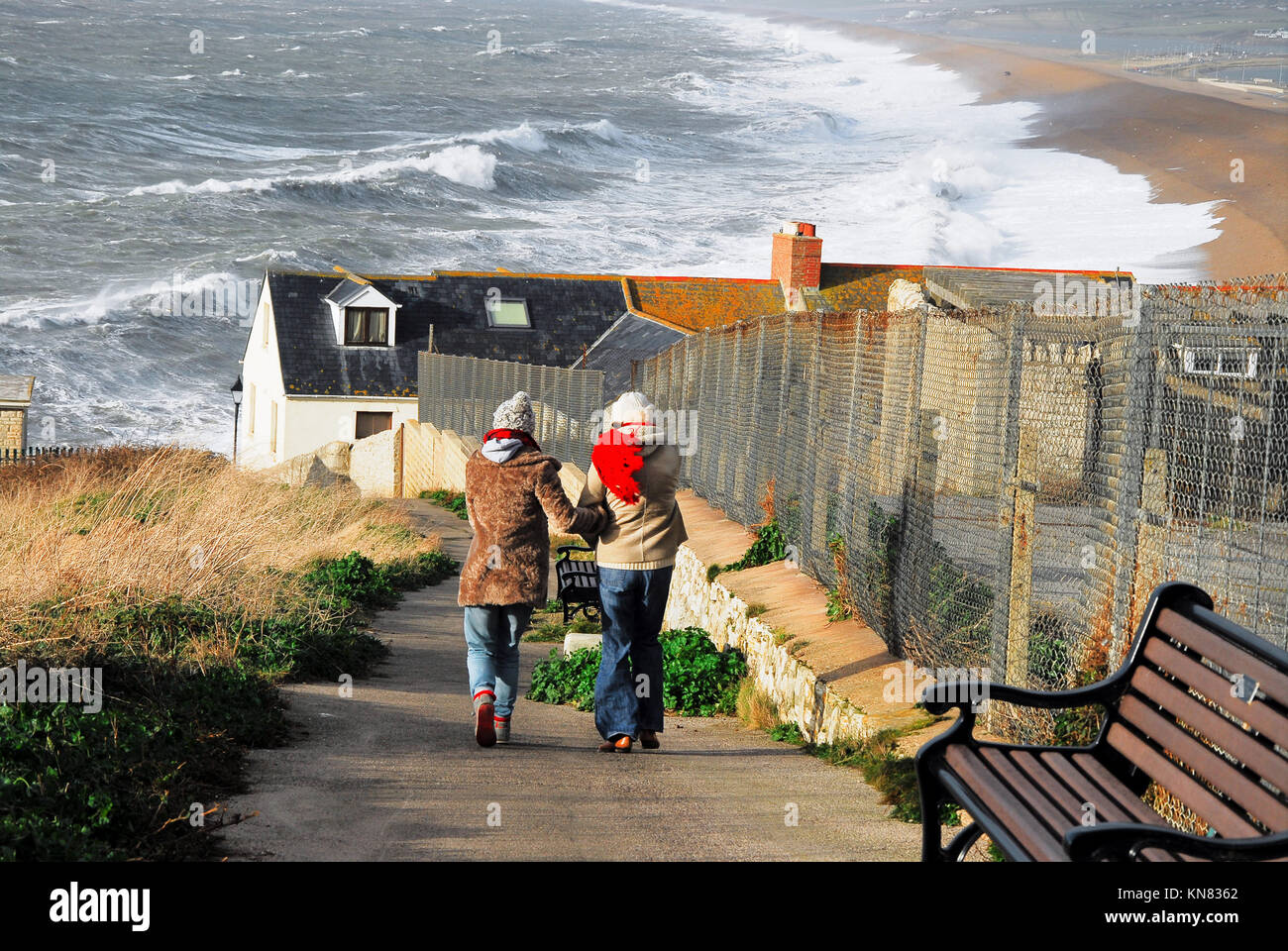 Chesil Beach, Portland, Dorset. 10th December 2017 Two women walk