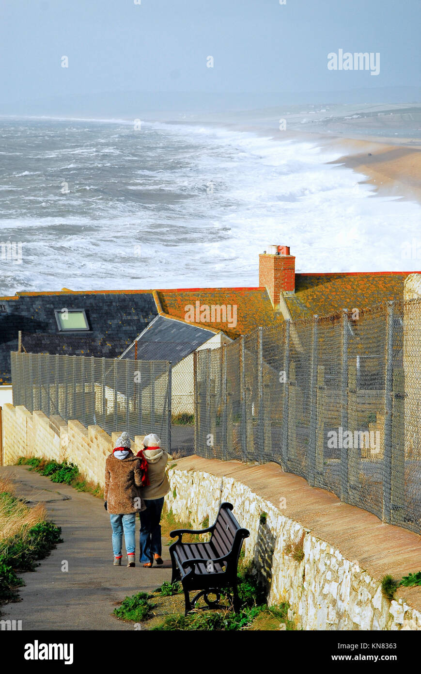 Chesil Beach, Portland, Dorset. 10th December 2017 Two women walk