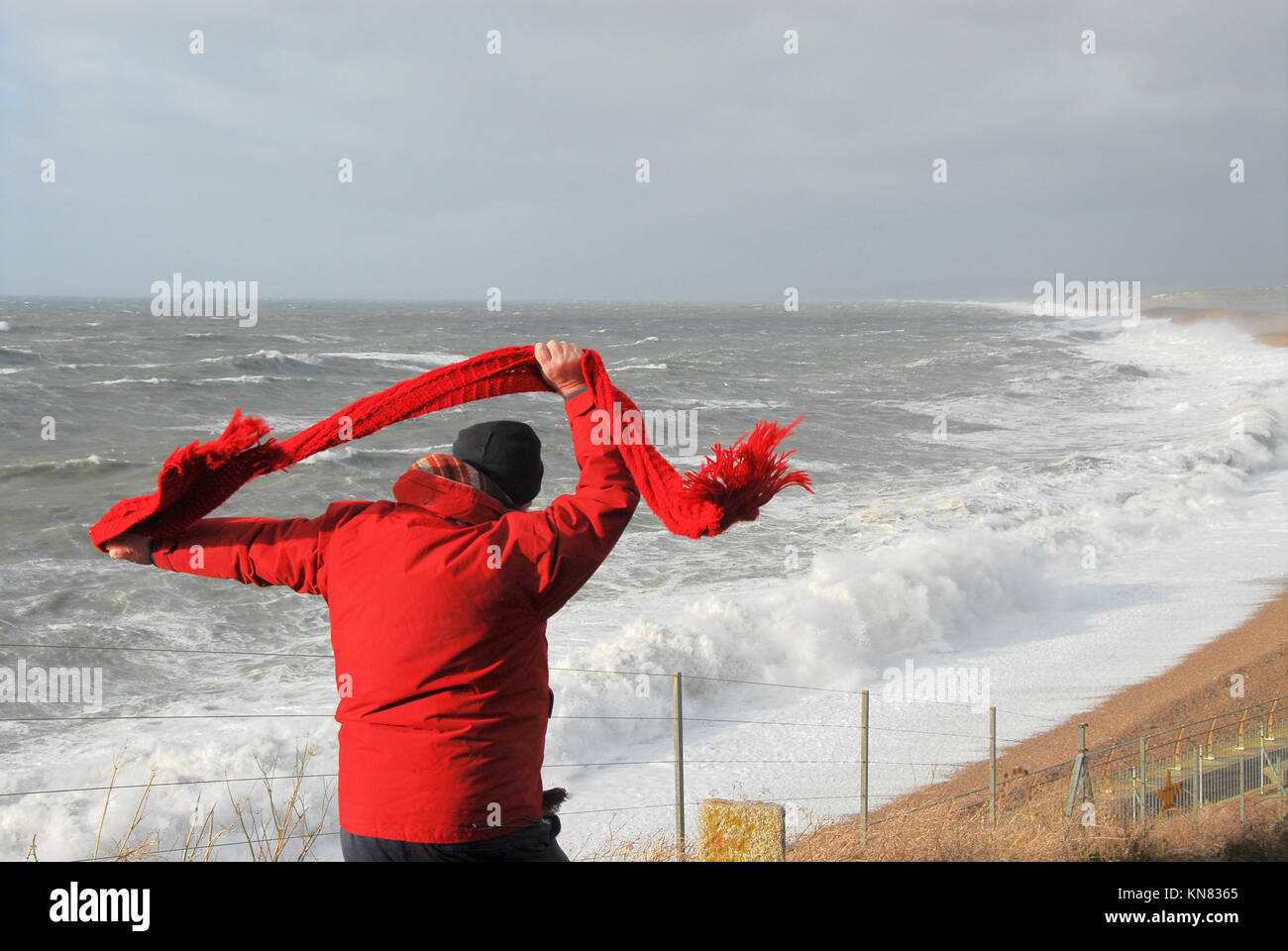 Chesil Beach, Portland, Dorset. 10th December 2017 A man struggles