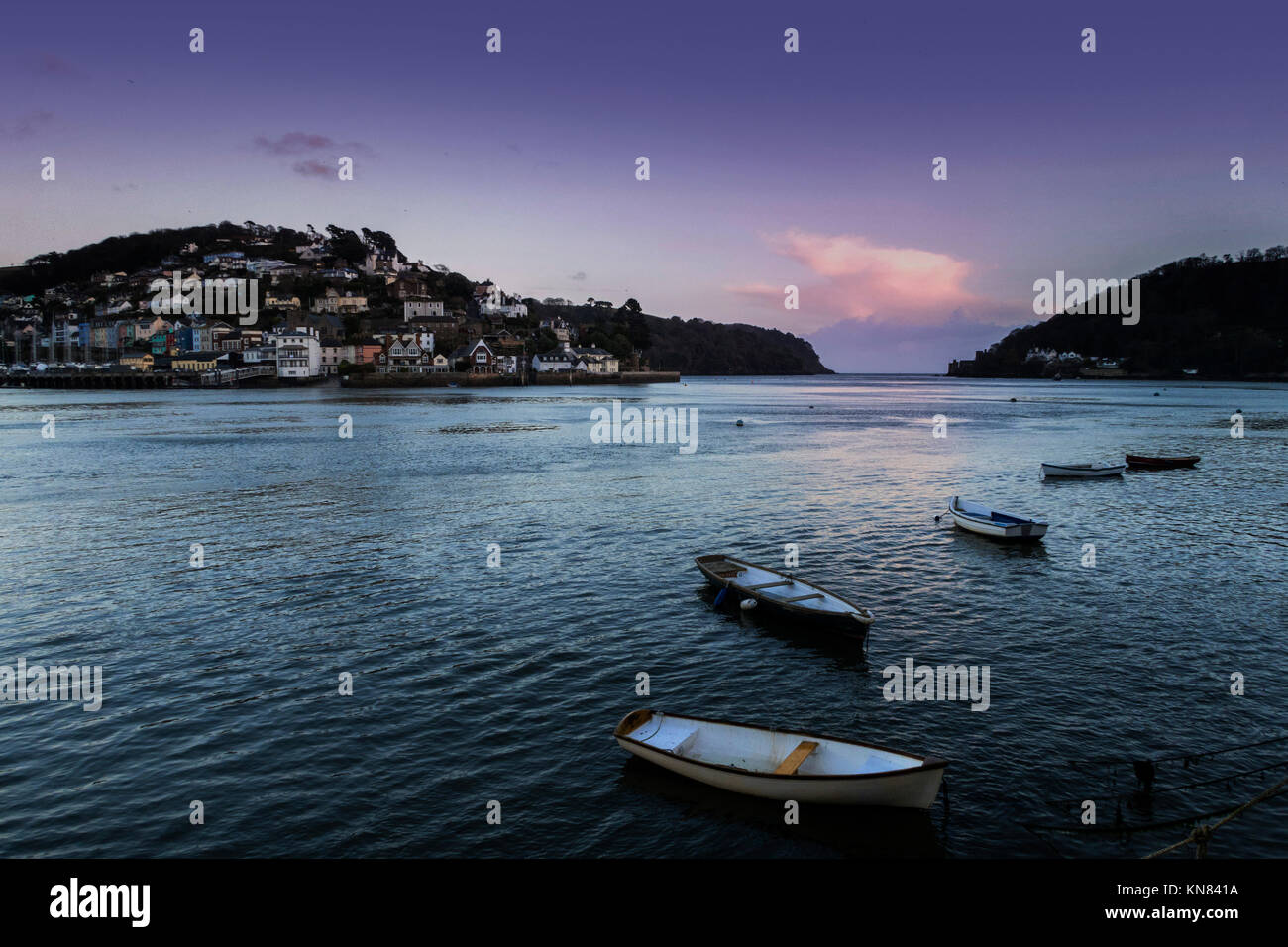 Dartmouth, 10th Dec 17 With the rest of the UK suffering freezing temperatures, the South West was the exception, with double figure temperatures across most of Devon. A few boats are seen on the river Dart as sunset falls in Dartmouth. Photo Central/Alamy Live News Stock Photo