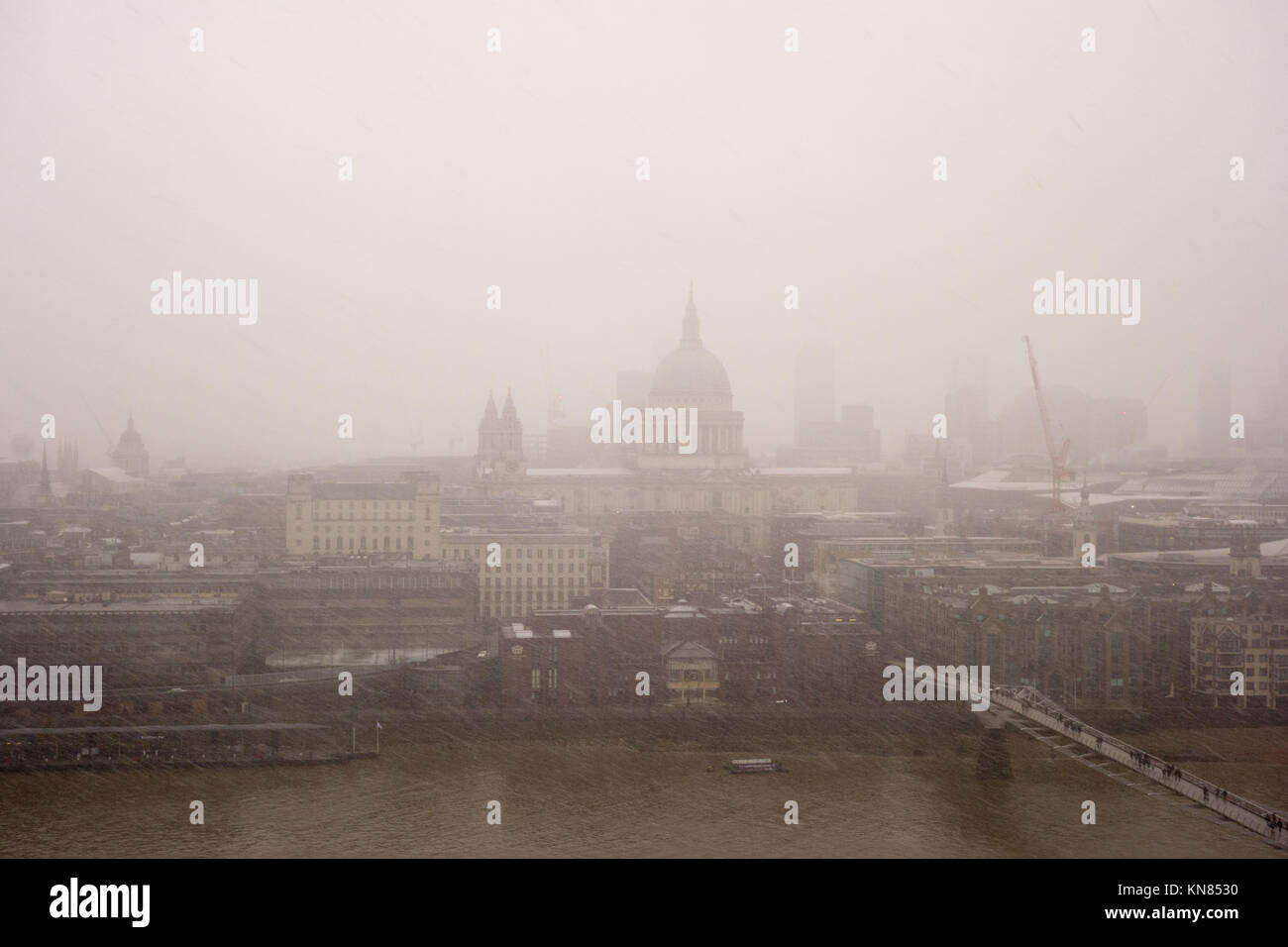 LONDON, UK. 10th Dec, 2017. Heavy snow falls across the City of London can be seen from the Viewing Level at Tate Modern. Credit: Fawcitt/Alamy Live News. Stock Photo