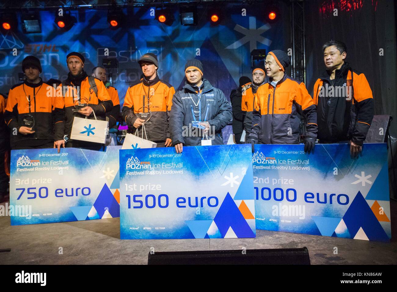 Poznan, Wielkopolska, Poland. 10th Dec, 2017. December 10, 2017 - Poznan, Poland - Poznan Ice Fesival is one of the biggest ice festivals in Europe. In today's main competition, sculptors worked in pairs for 8 hours, making a sculpture on any topic. In the picture from the left: MAREK SZEWCZYK (Pol) and SEBASTIAN SANCHEZ (Fra) - 3rd prize; JESS PARISH and ANGELITO BABAN (both: USA) - 1st prize; ROSS BAISAS (Can) and ANTONIO BAISAS (Phi) - 2nd prize. THE PUBLICATION IN THE NEGATIVE CONTEXT IS FORBIDDEN Credit: Dawid Tatarkiewicz/ZUMA Wire/Alamy Live News Stock Photo