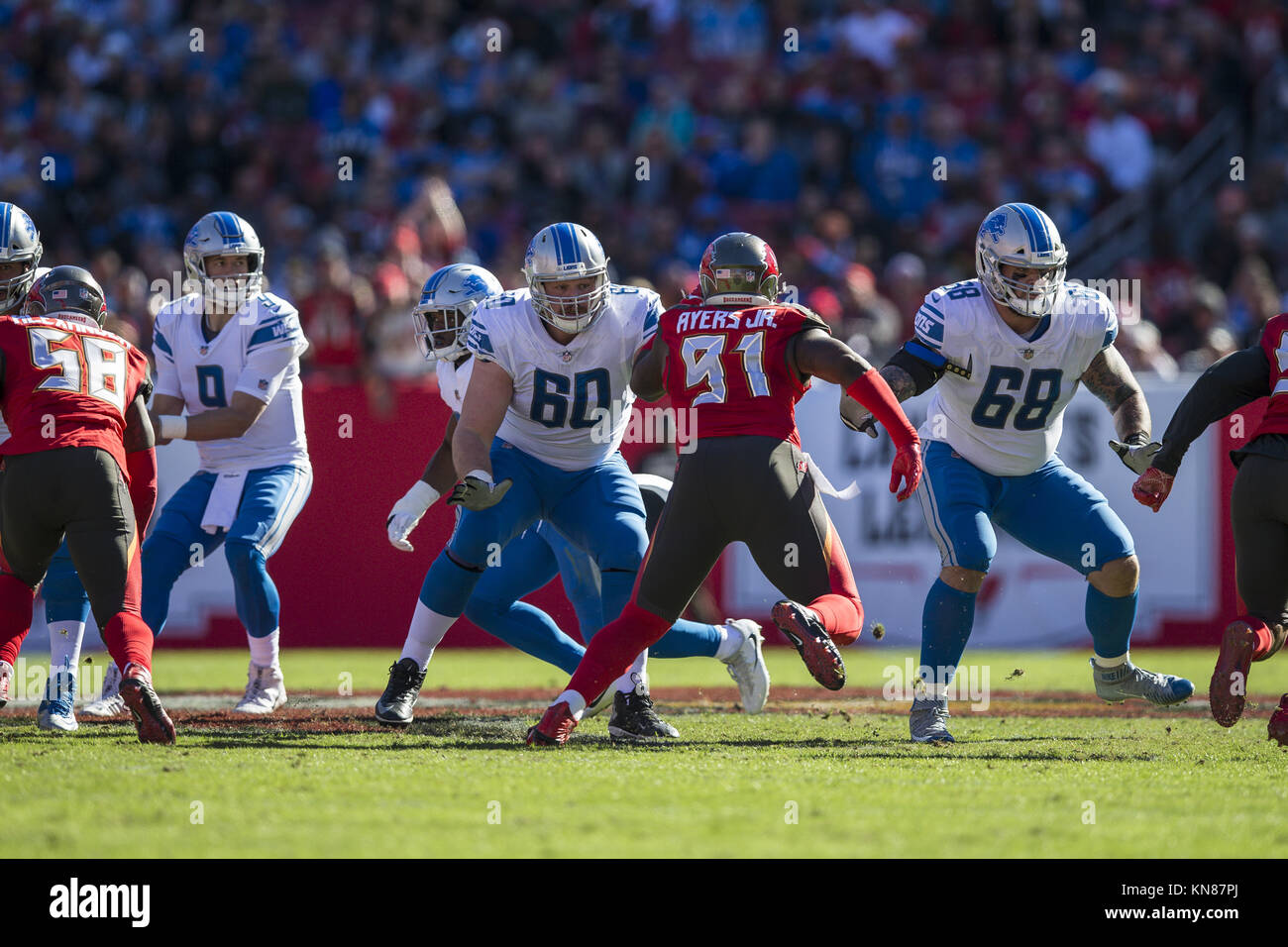 Tampa, Florida, USA. 10th Dec, 2017. Detroit Lions offensive guard Graham Glasgow (60) looks to block against Tampa Bay Buccaneers defensive end Robert Ayers (91) during the game on Sunday December 10, 2017 at Raymond James Stadium in Tampa, Florida. Credit: Travis Pendergrass/ZUMA Wire/Alamy Live News Stock Photo