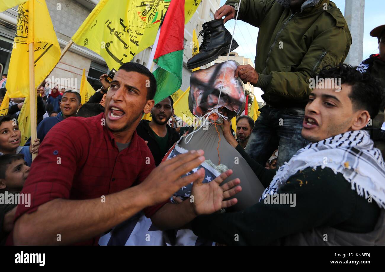 Nusairat, Gaza Strip, Palestinian Territory. 11th Dec, 2017. Palestinians take part in a protest against US President Donald Trump's decision to recognise Jerusalem as the capital of Israel, in al-Nusairat in the center of Gaza strip December 11, 2017 Credit: Ashraf Amra/APA Images/ZUMA Wire/Alamy Live News Stock Photo