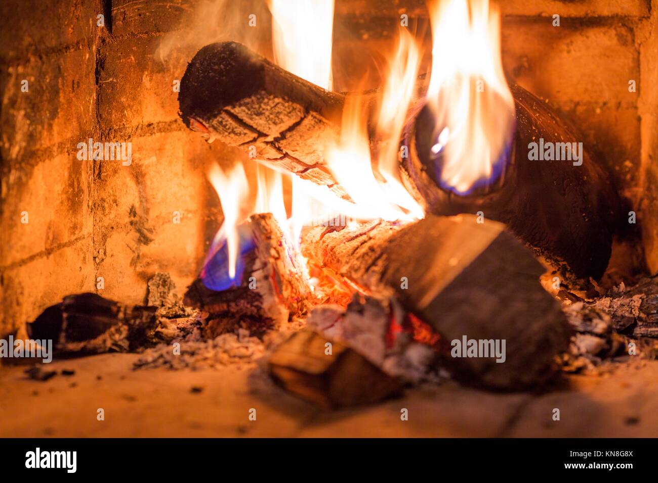 Firewood burning in fireplace interior shot fire Stock Photo Alamy