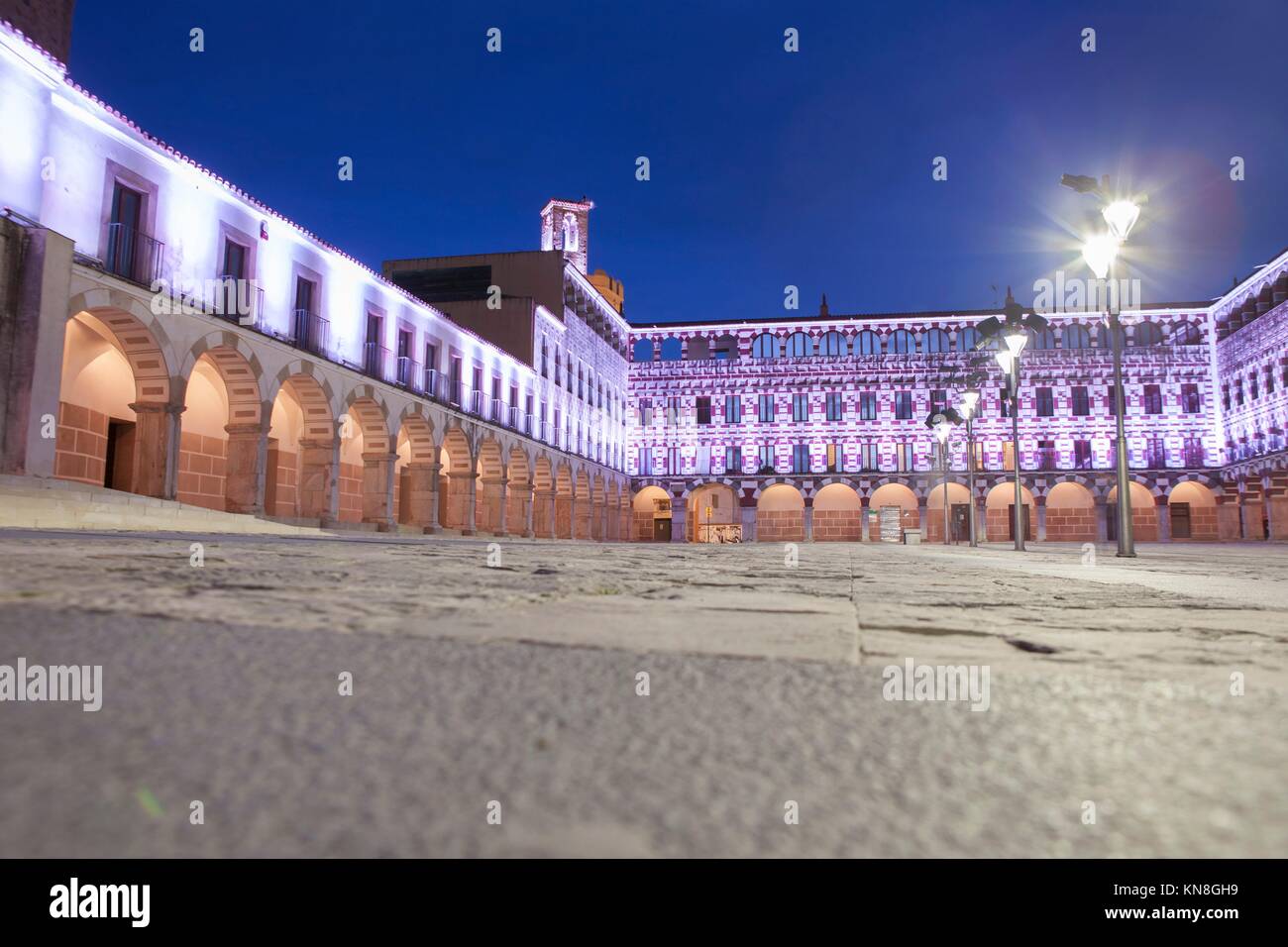 Hight square of Badajoz, illuminated by led lights at twilight. Low angle view from the floor. Stock Photo