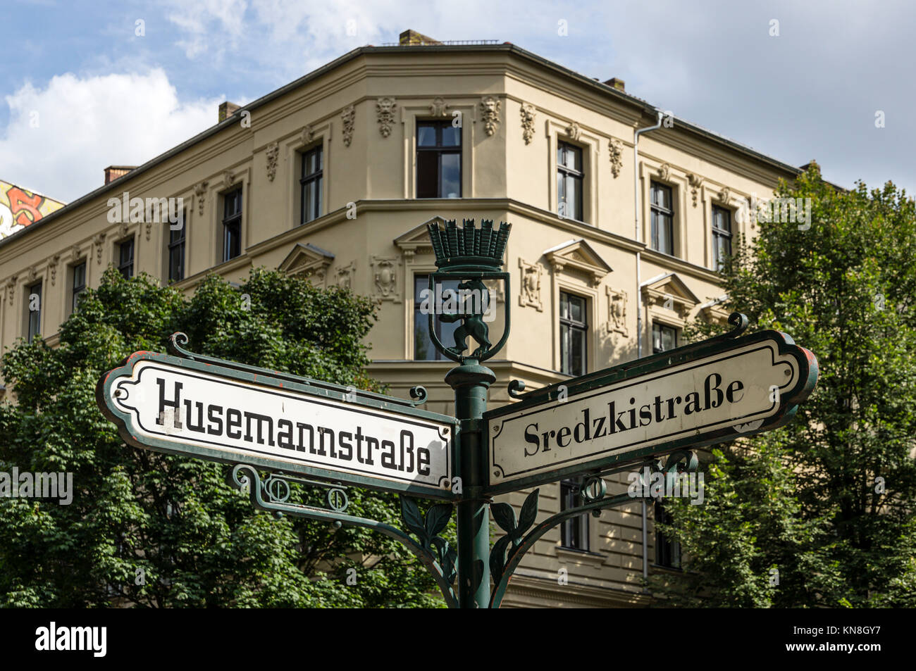 Street sign on the corner of Husemann Straße in East Berlin's Mitte district Stock Photo