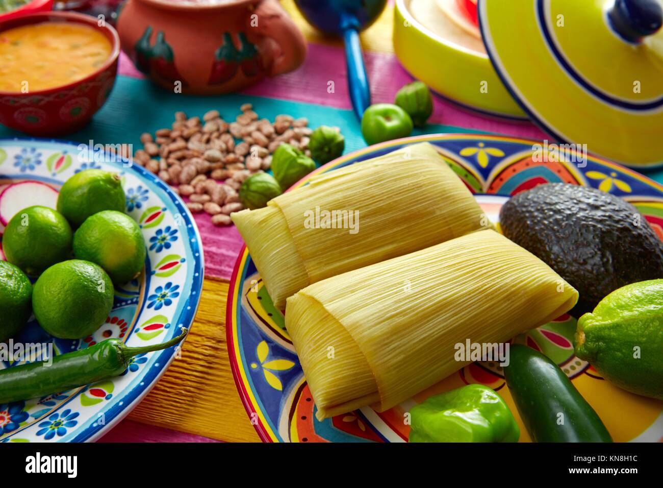 Mexican Tamale tamales of corn leaves with chili and sauces Stock Photo