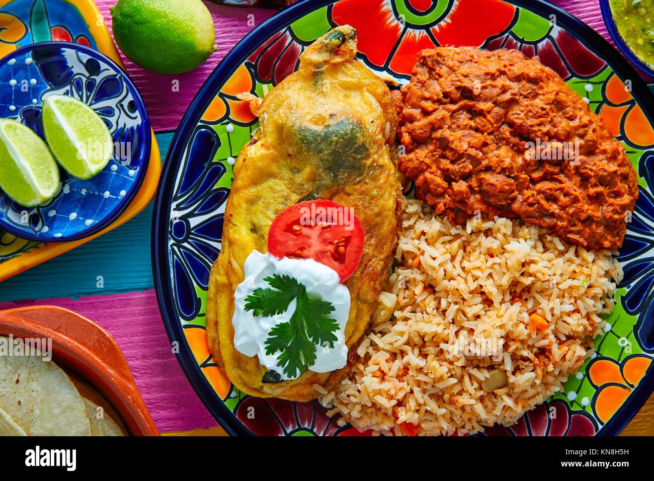 Chili relleno chili pepper poblano filled with cheese in dish with with