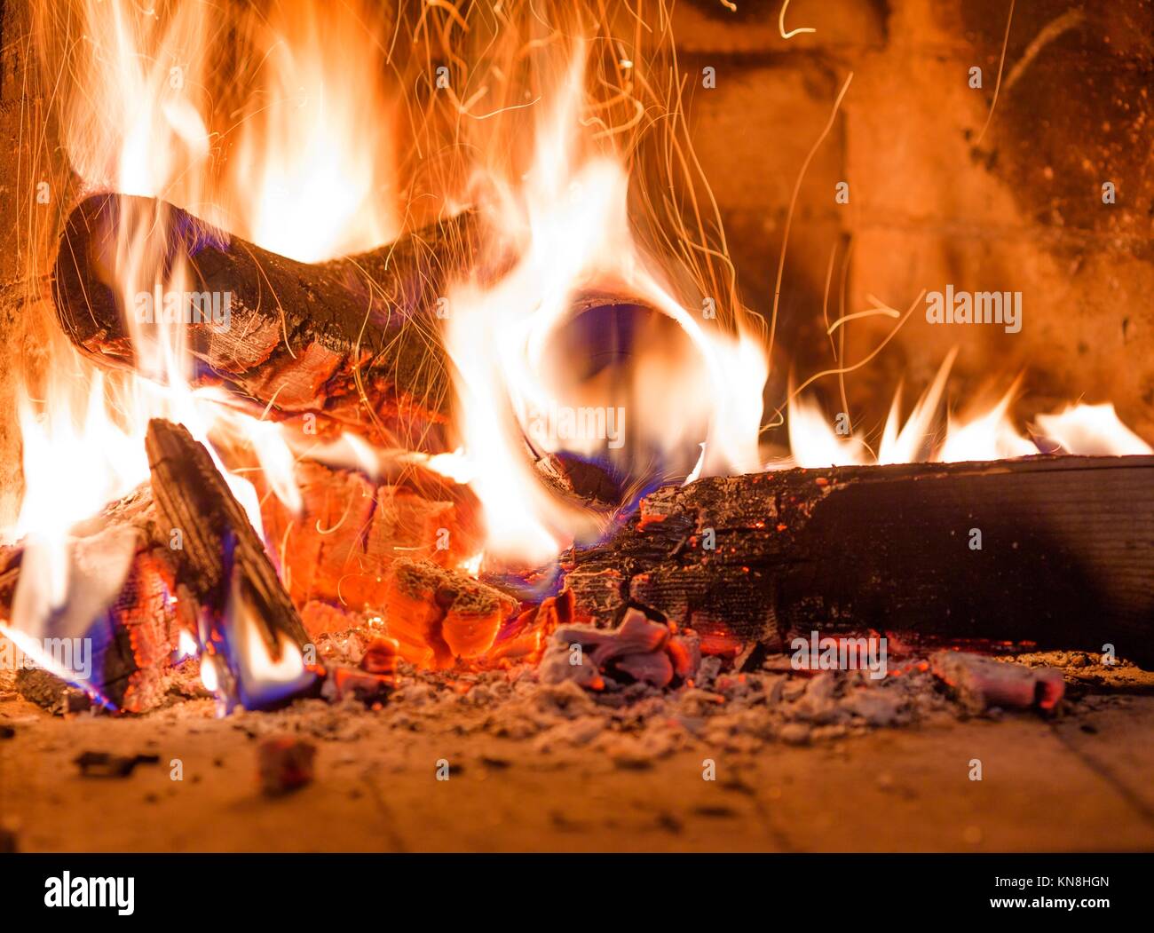 Firewood Burning In Fireplace Fire Red Ashes Heat Stock Photo