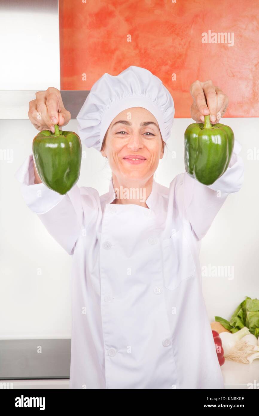 portrait of happy chef woman with professional jacket and hat