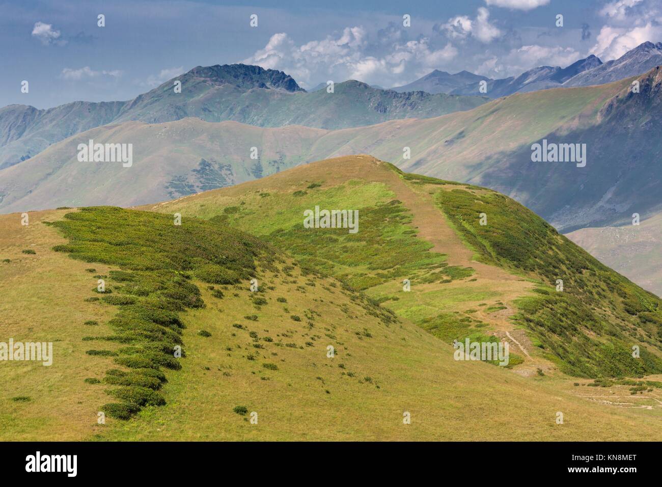 Beautiful landscape with green hills and mountais. Stock Photo