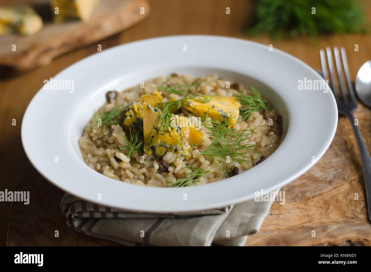 Mushroom risotto with melted blue cheese and dill Stock Photo Alamy
