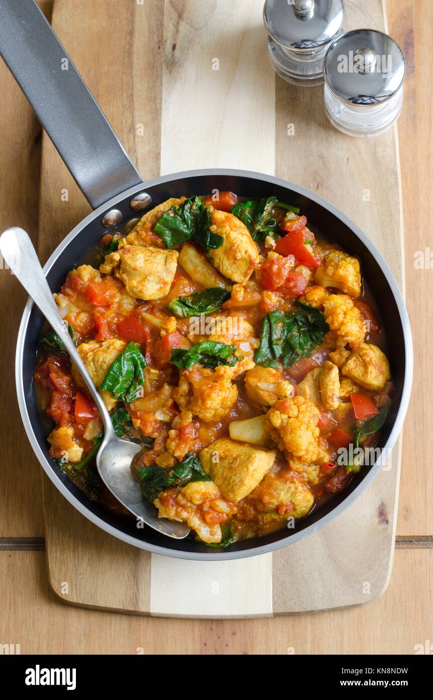 Chicken curry with cauliflower and spinach Stock Photo - Alamy