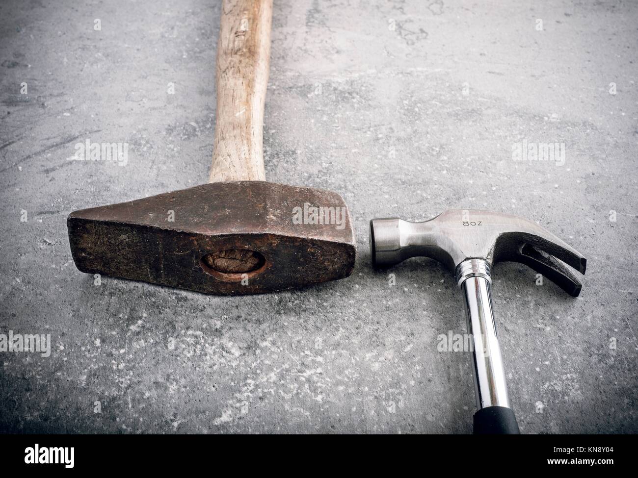 Hammer still life. Two hammers side by side on a stone workbench