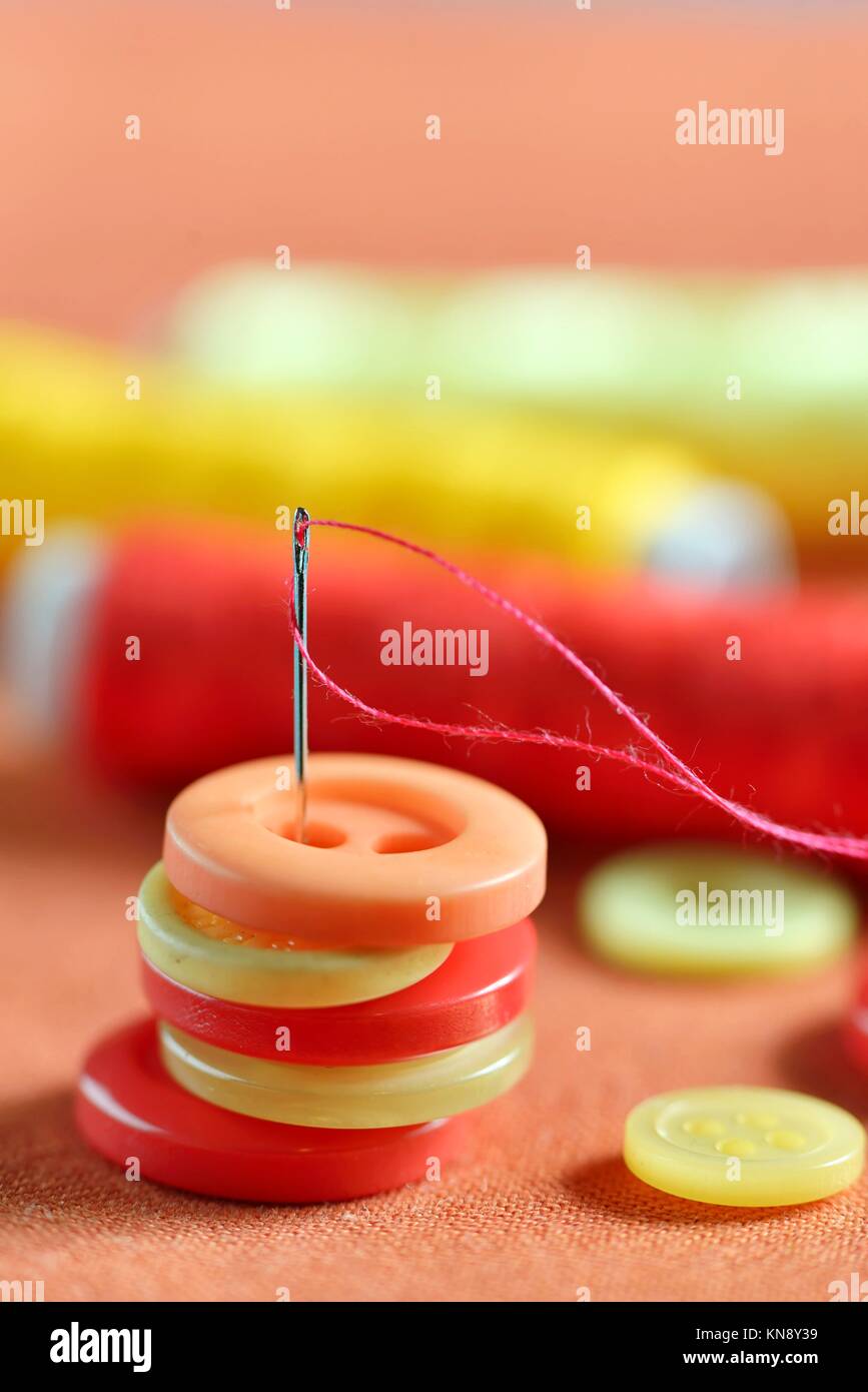 Accessories Sewing button on cloth Stock Photo Alamy