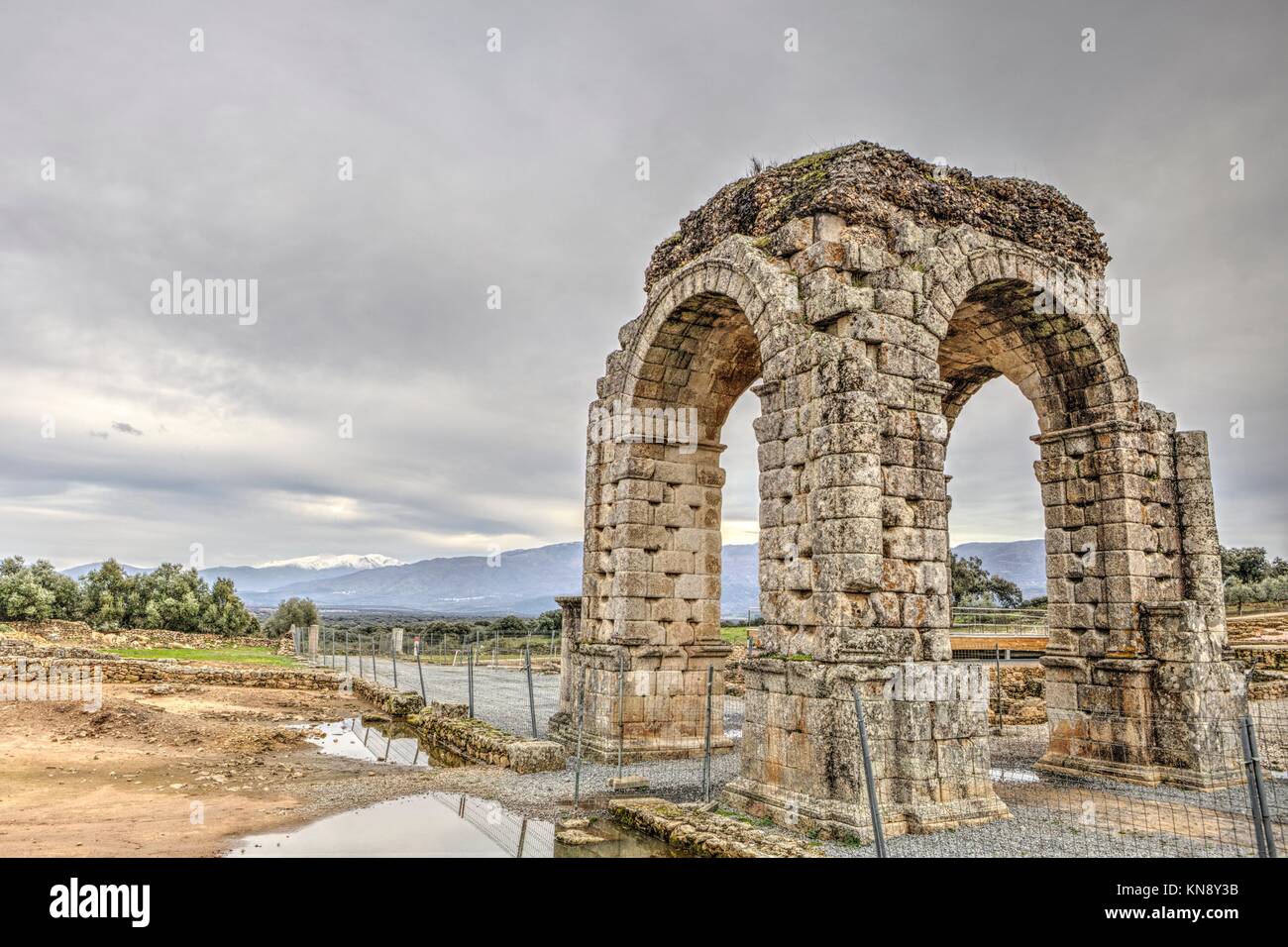 Roman Arch of Caparra, (1st-2nd century AD). Crossroad ancient city ruins at Silver Route, Via de la Plata, Caceres, Spain. Stock Photo