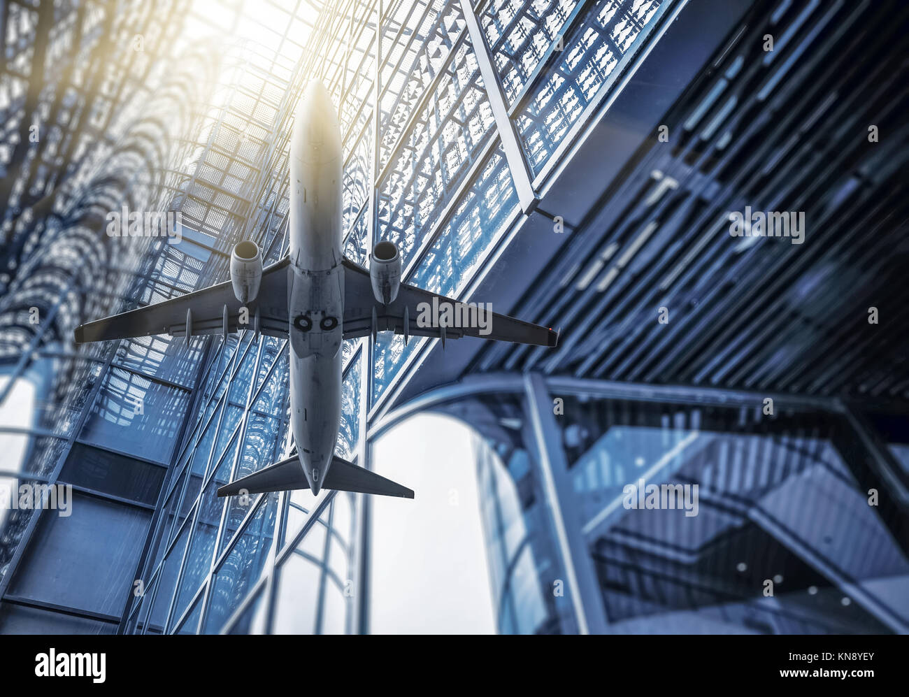 modern architecture with a plane in blue tone Stock Photo - Alamy