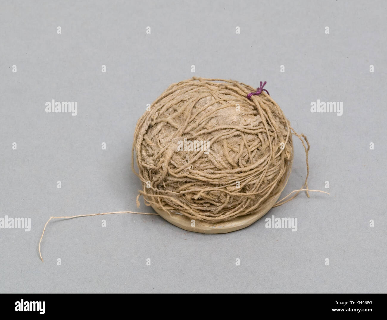 Ball of thread used for sewing or textile work, representing domestic ...