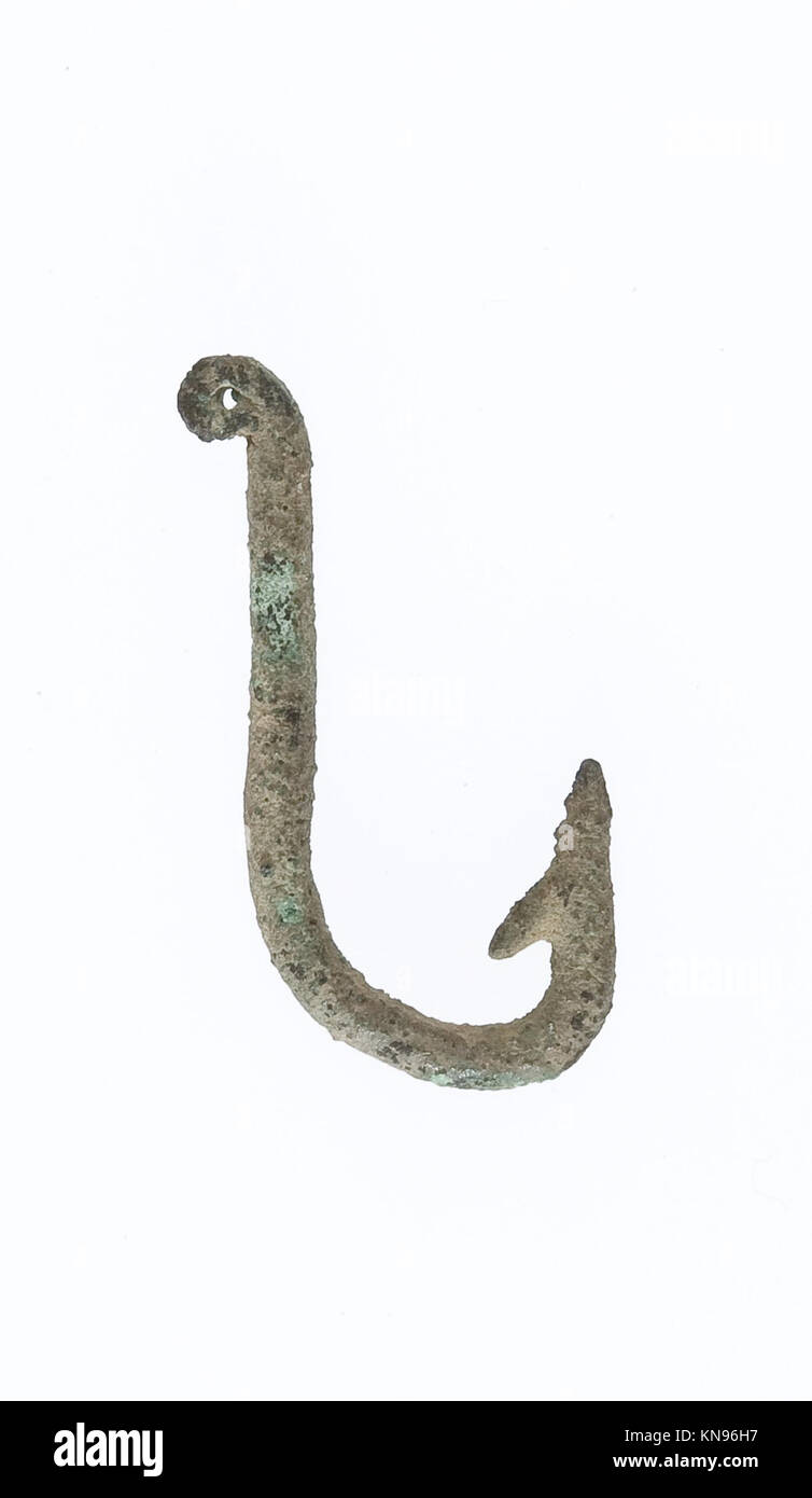 This ancient fish hook demonstrates early craftsmanship, functional design,  and use in fishing and survival practices Stock Photo - Alamy