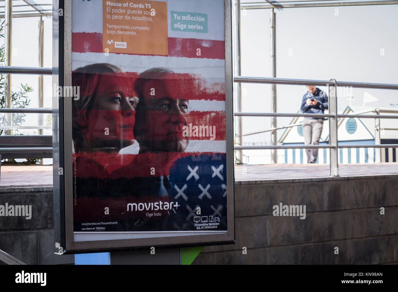 Image of Kevin Spacey promoting House of Cards on advertizing hoarding on telephone kiosk in Spain. Stock Photo