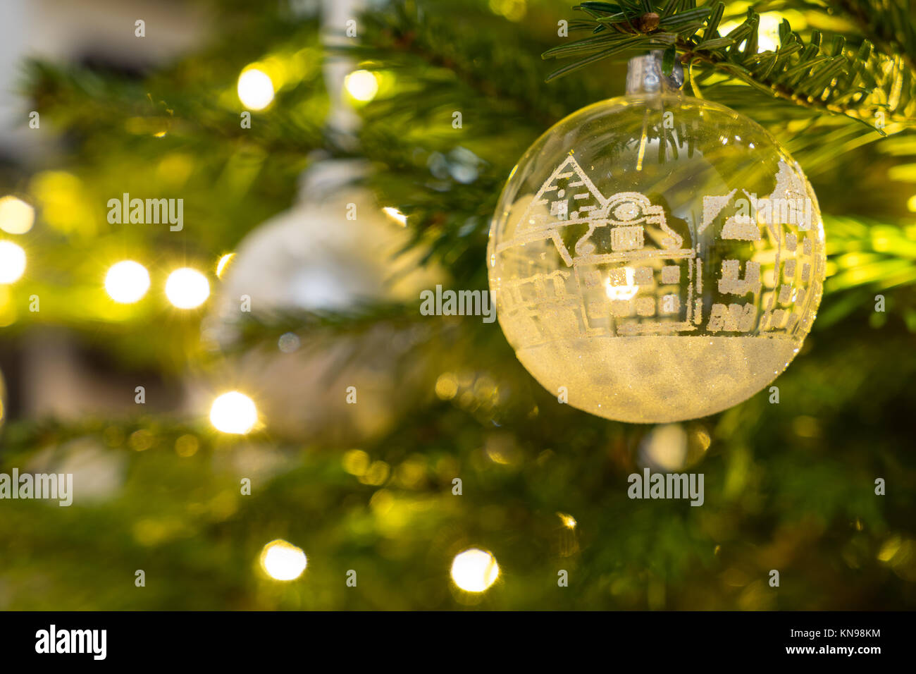 Christmas decoration glass and white ball hanging in a Nordman christmastree Stock Photo