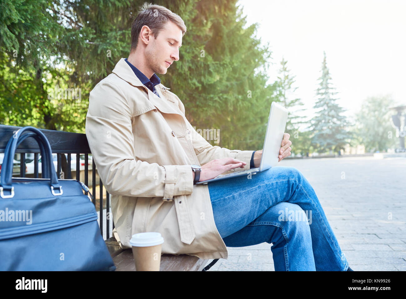 Businessman Man Using Laptop in Park Stock Photo - Alamy