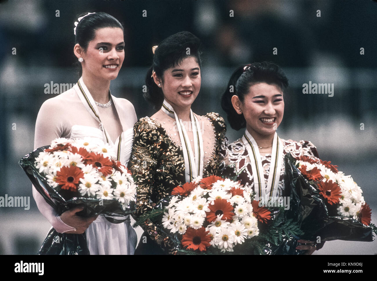 Kristi Yamaguchi (USA) Olympic Champion with silver medalist Nancy Kerrigan and bronze medalist Midori Ito at the 1992 Olympic Winter Games. Stock Photo