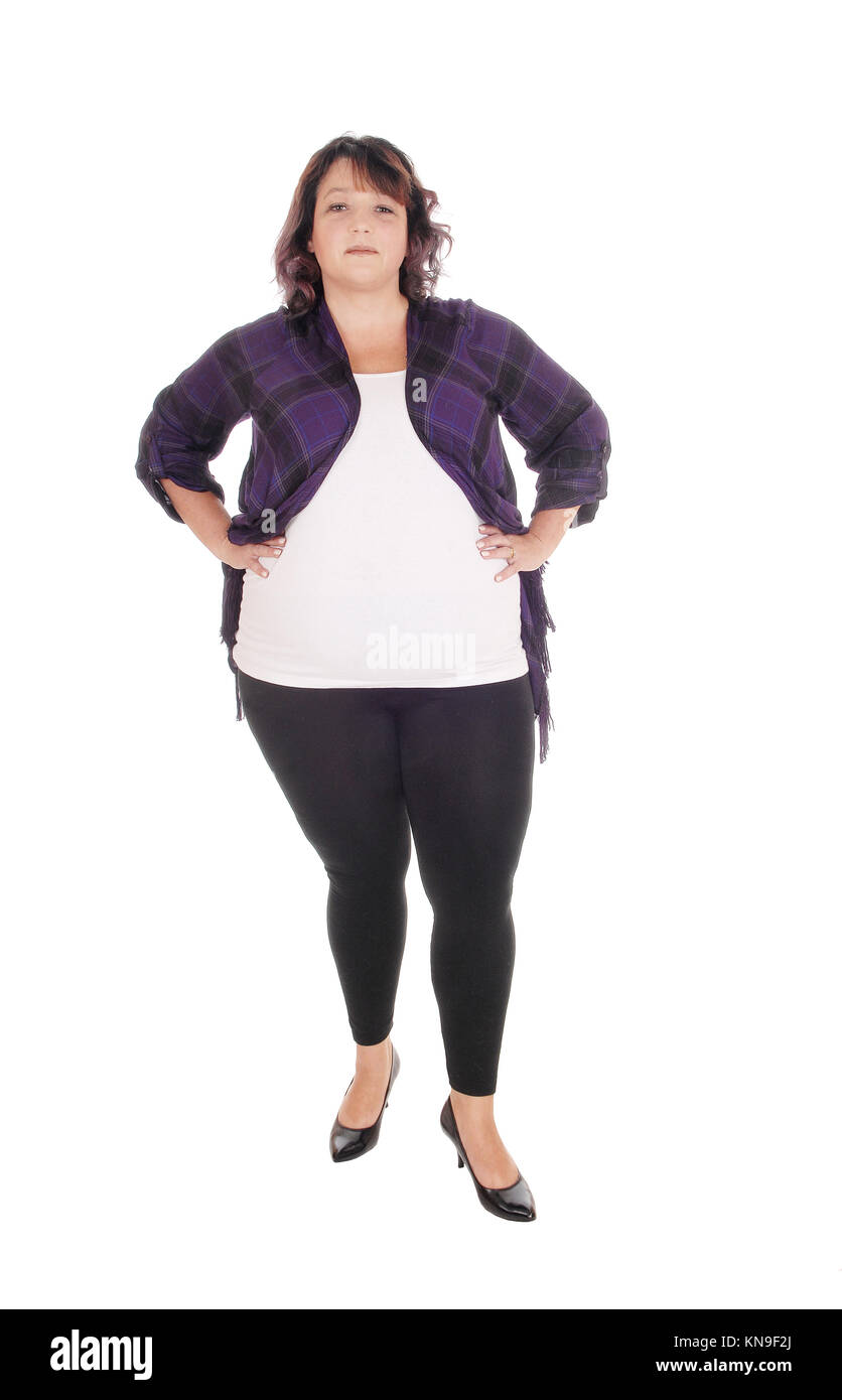 A lovely overweight woman in her forties standing from front in tights isolated for white background Stock Photo Alamy