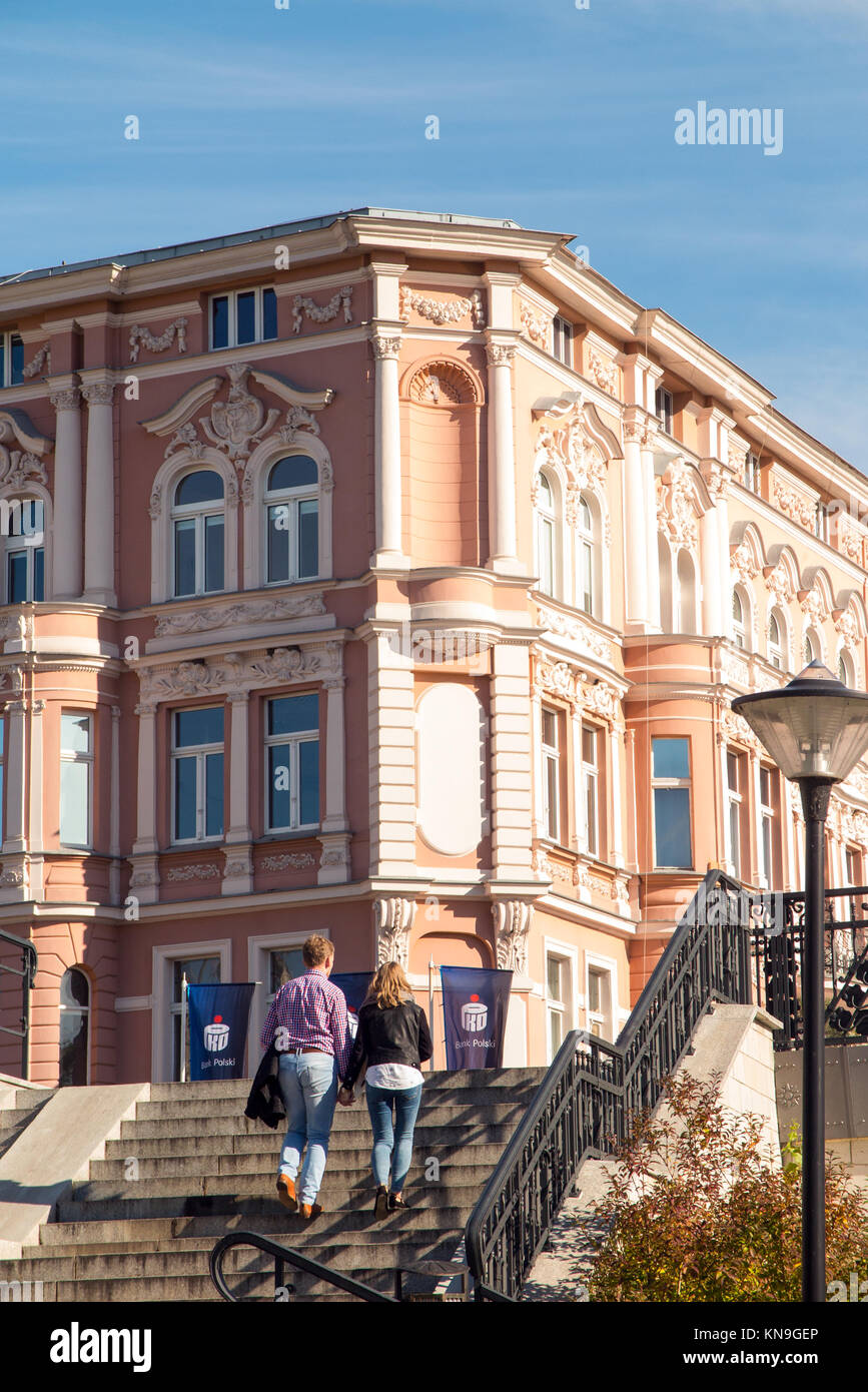 people walking  along the banks of the river Brda in the Polish city of Bydgoszcz Poland  enjoying the sunshine Stock Photo