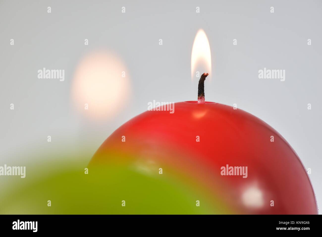 Burning candles Green and red candles studio shoot Stock Photo Alamy