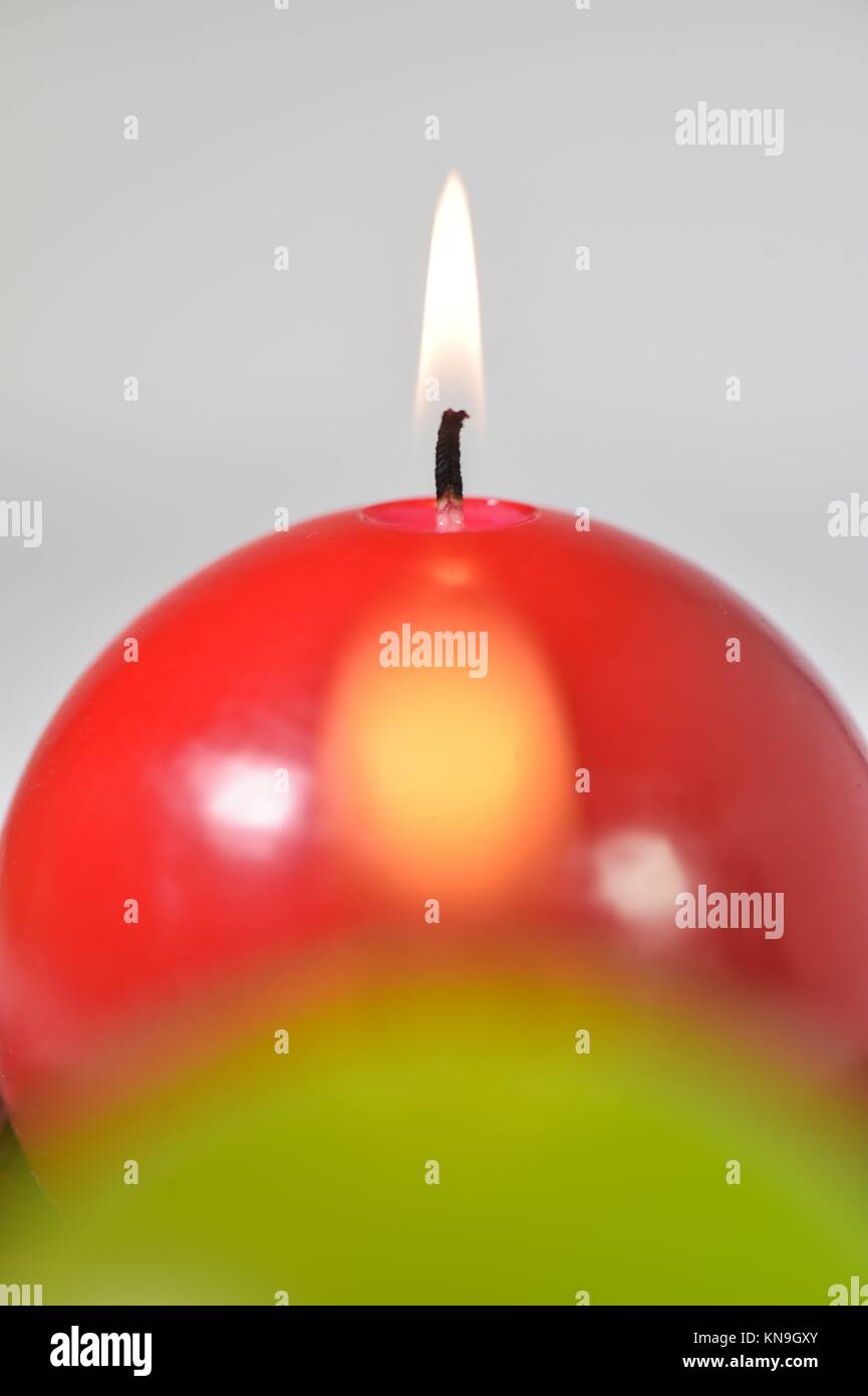 Burning candles Green and red candles studio shoot Stock Photo Alamy