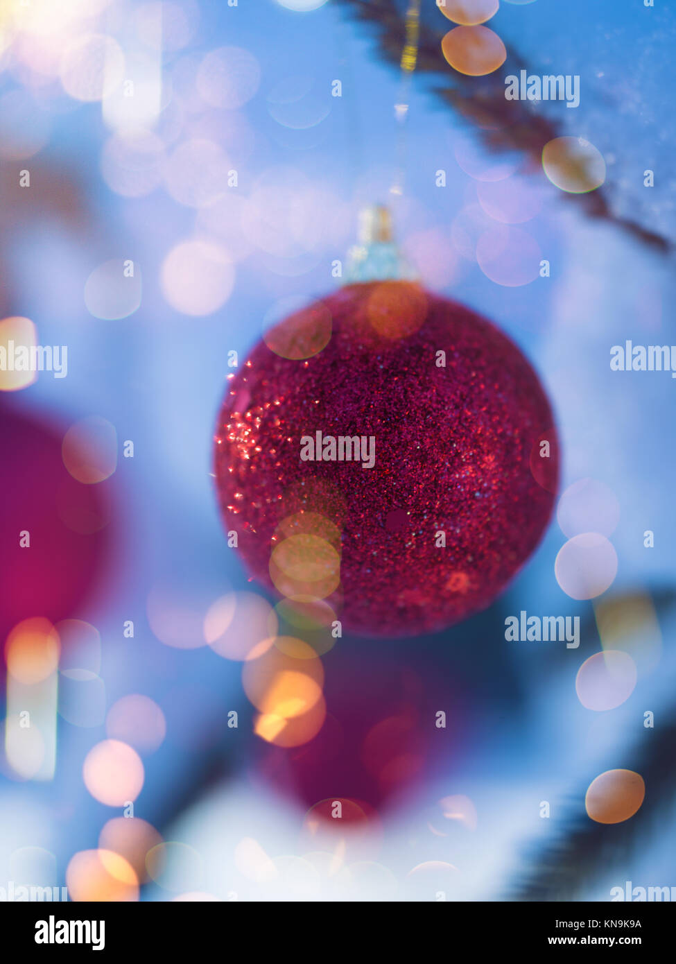 christmas tree red ball decoration with real snow Stock Photo - Alamy