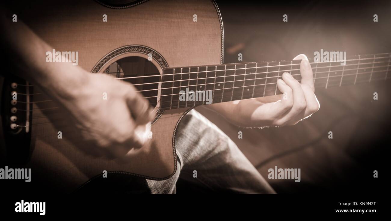 Close up of hands on the strings of a guitar, France Stock Photo Alamy