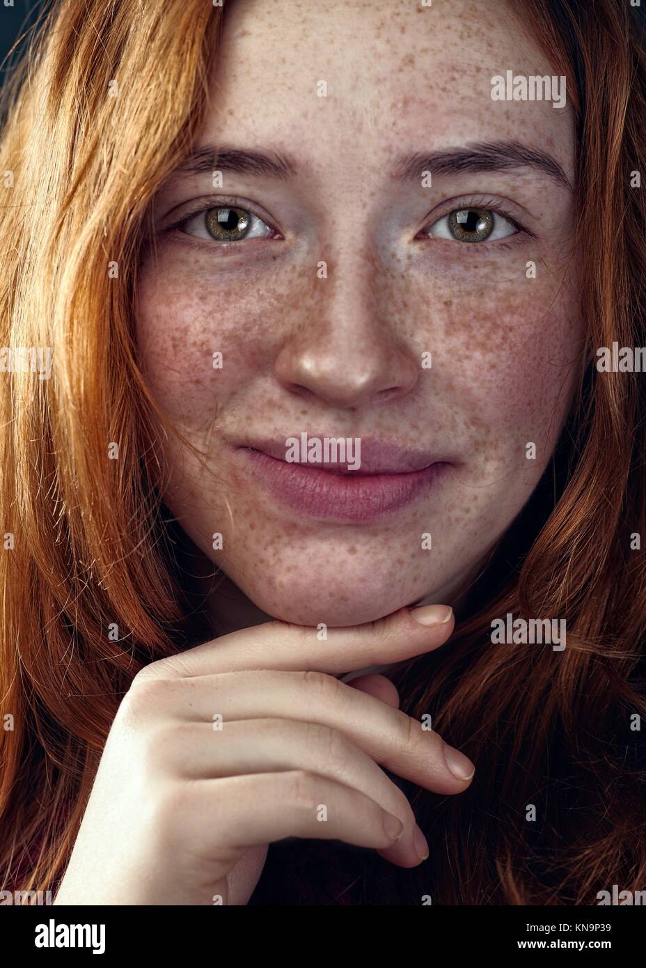 Redhead woman with funny freckles, female portrait. Stock Photo