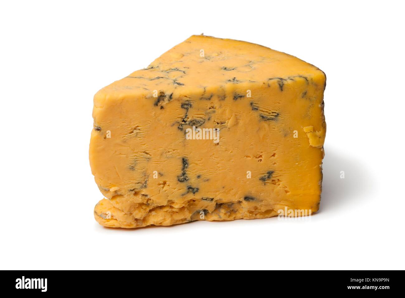 Wedge of English Shropshire Blue cheese on white background. Stock Photo