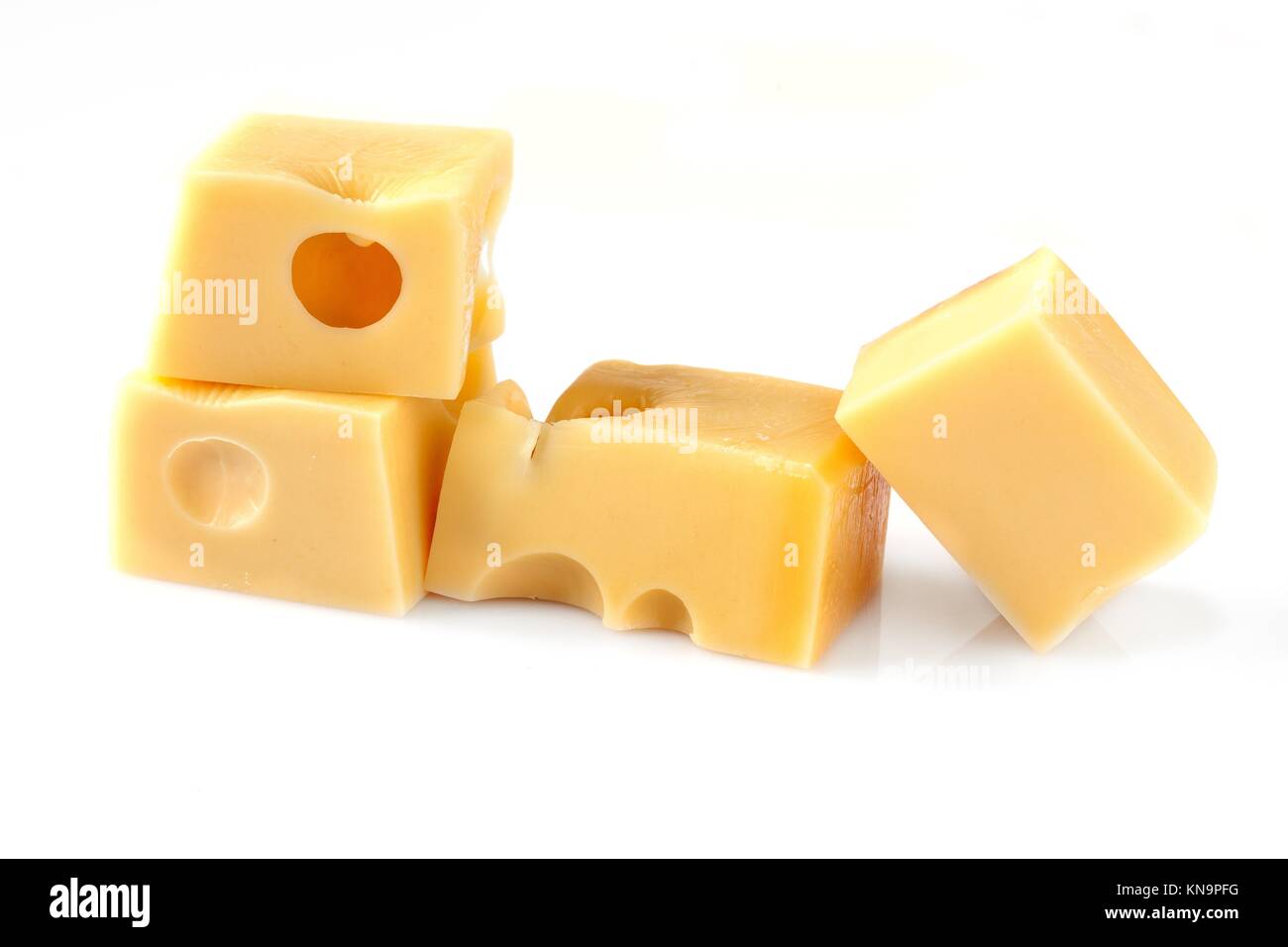 Pieces of Emmental swiss cheese, isolated on white background. Stock Photo