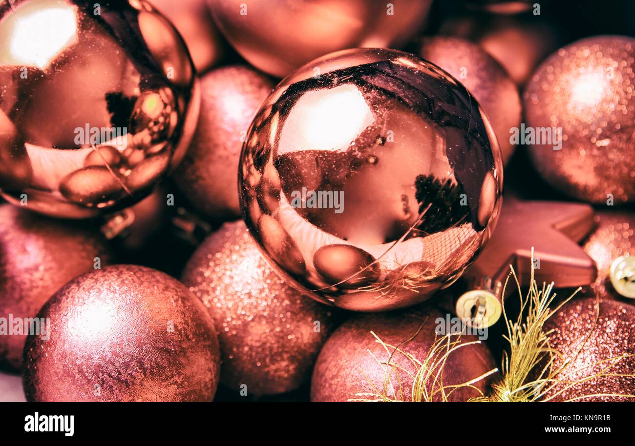 Selection of copper Christmas balls and stars for tree decoration. Stock Photo