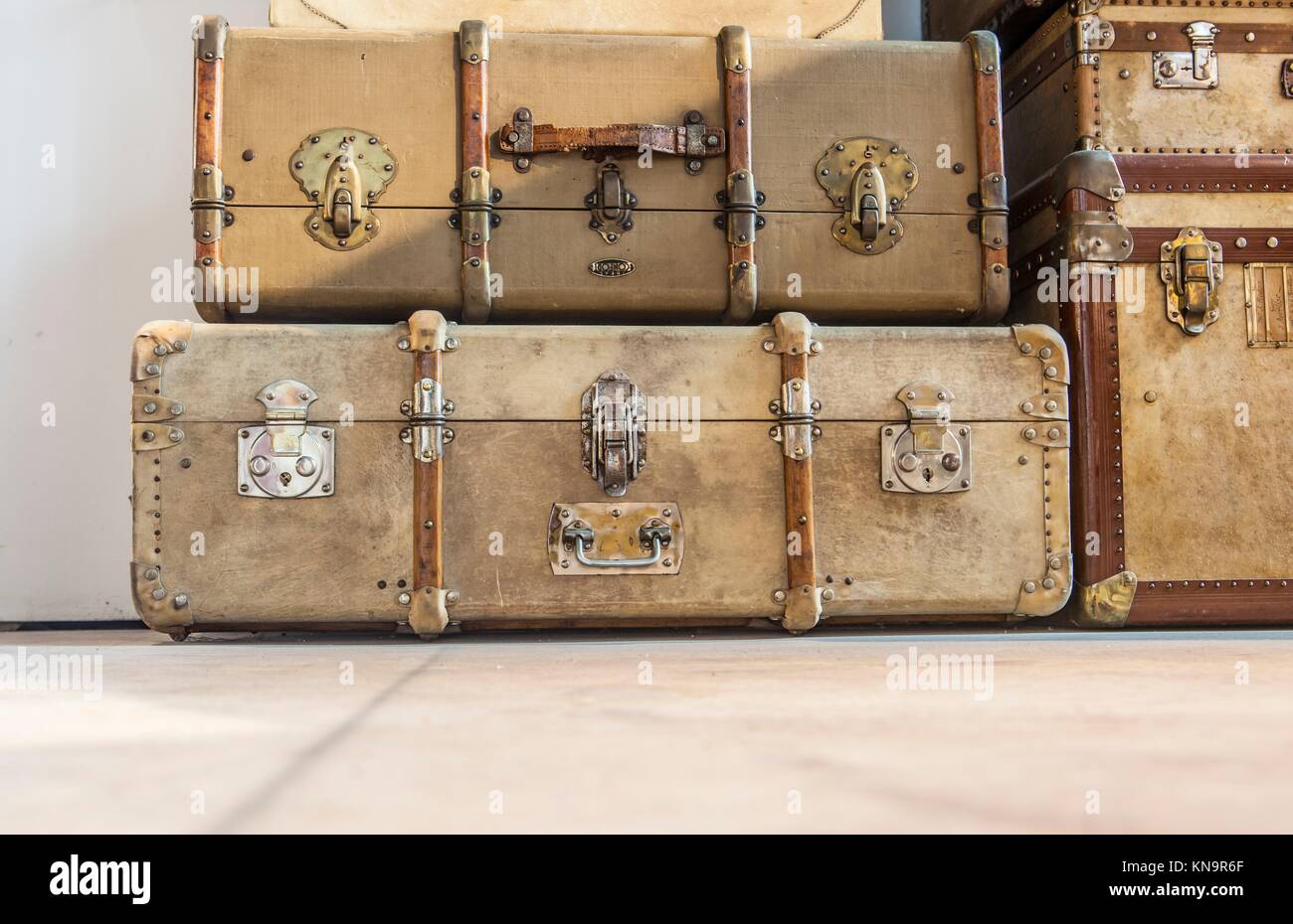 Antique brown leather luggage suitcases on the floor. Stock Photo