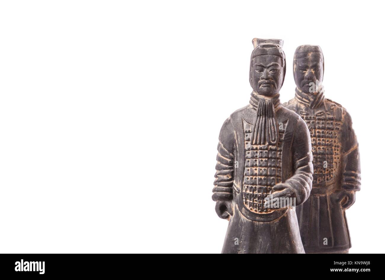 Replicas of two terracotta soldiers. Isolated over white background. Stock Photo