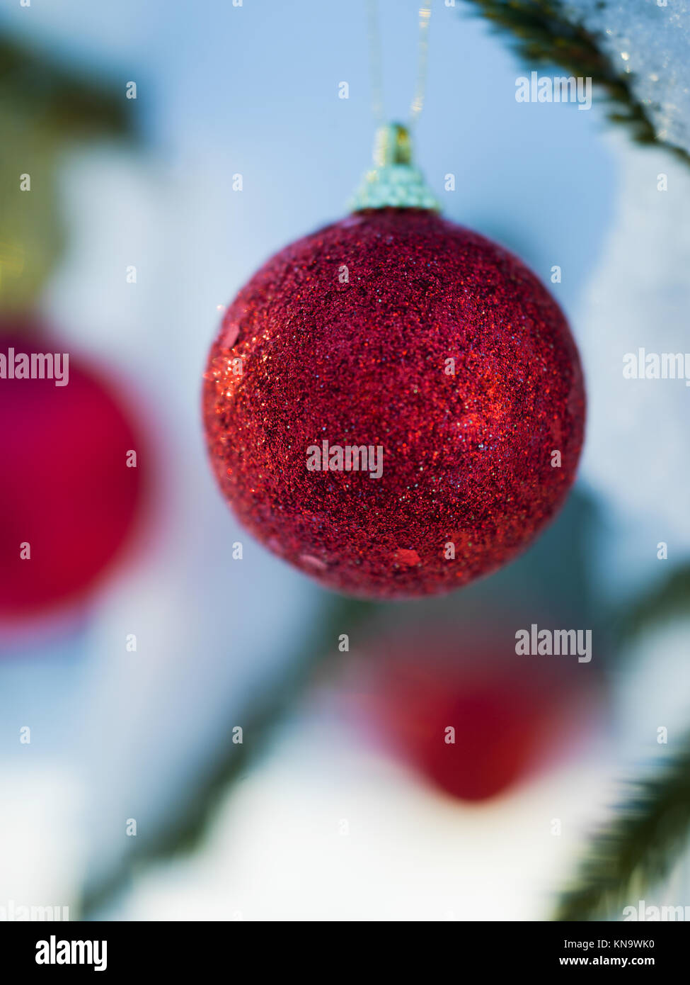 christmas tree red ball decoration with real snow Stock Photo - Alamy
