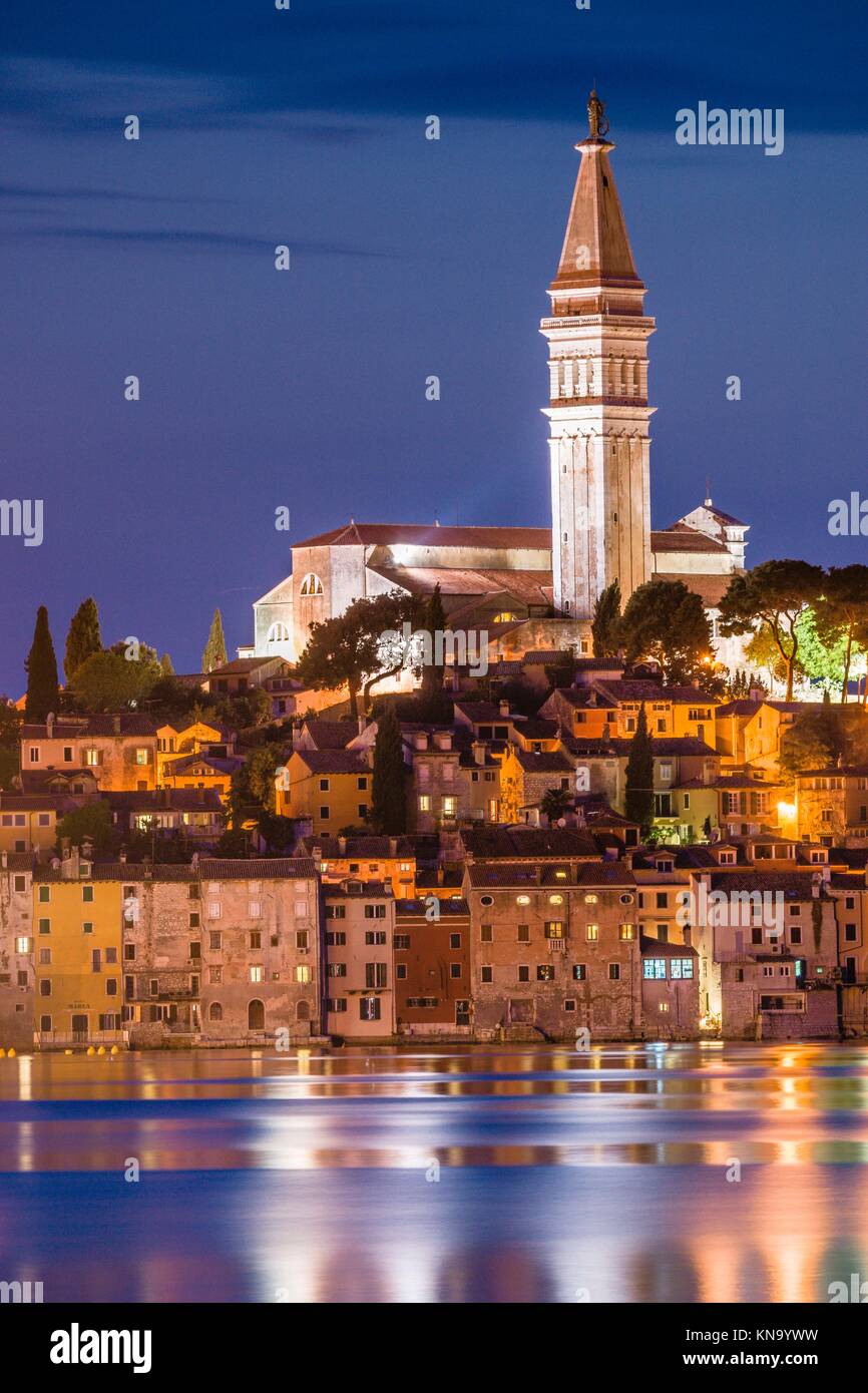 Croatia, Istria Peninsula, Rovinj, Illuminated waterfront buildings and bell tower. Stock Photo