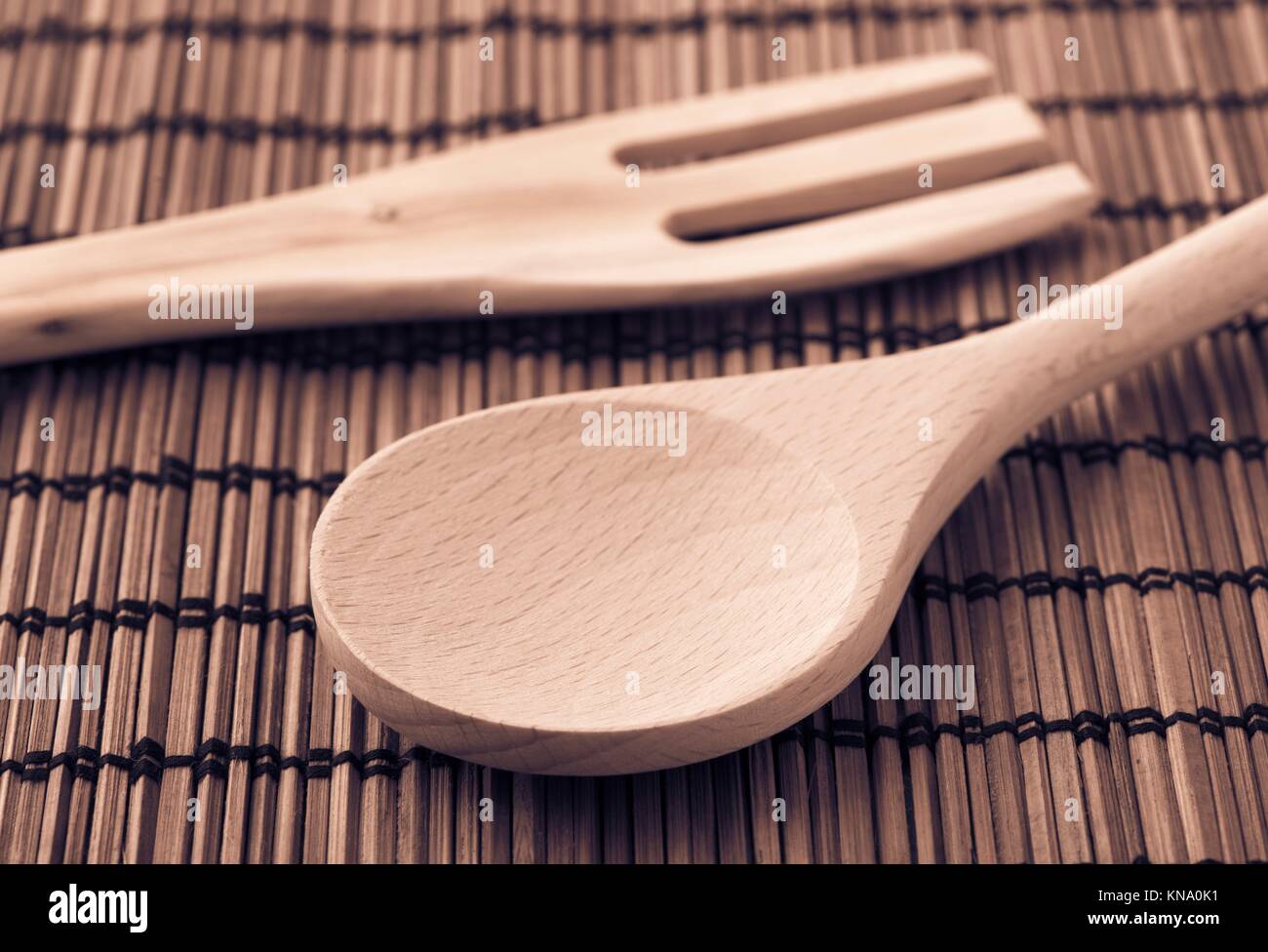 Wooden kitchen utensils, fork and spoon Still life image with concept