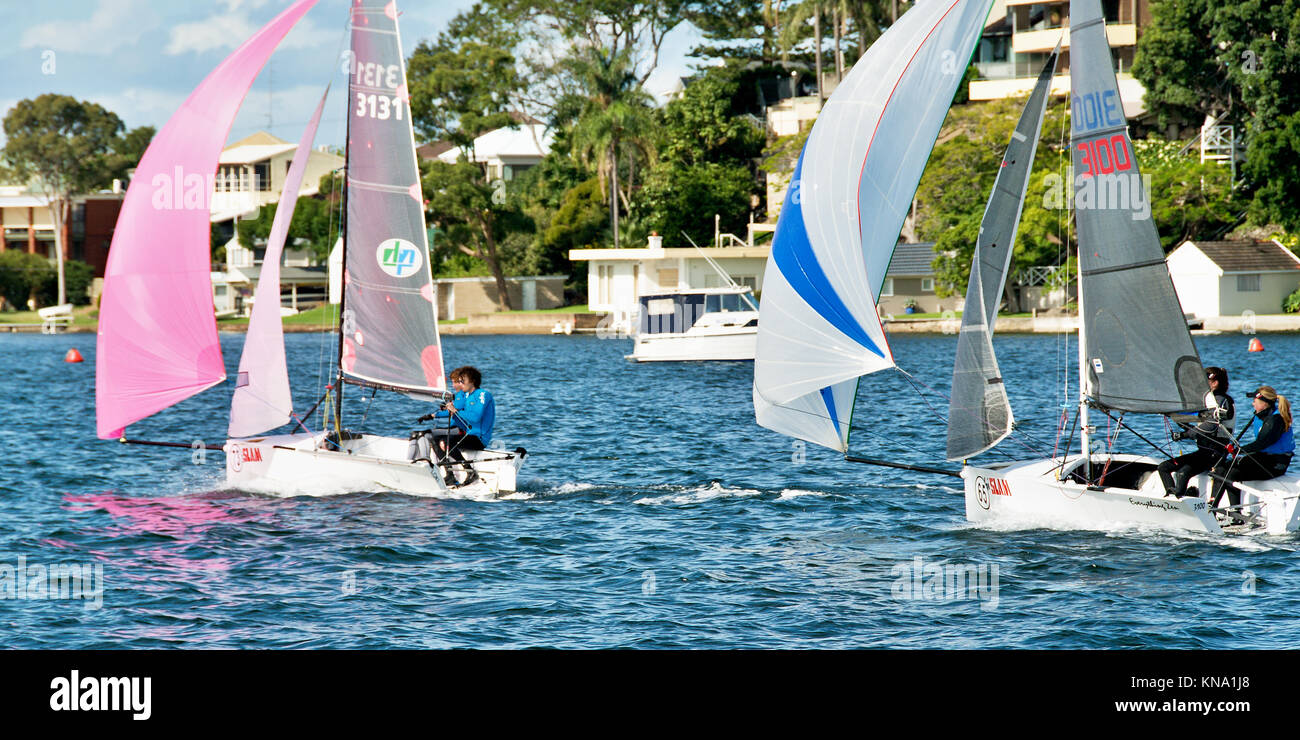 Lake Macquarie, Australia - April 17. 2013: Children competing in the Australian Combined High School Sailing Championships. Young contestants racing Stock Photo