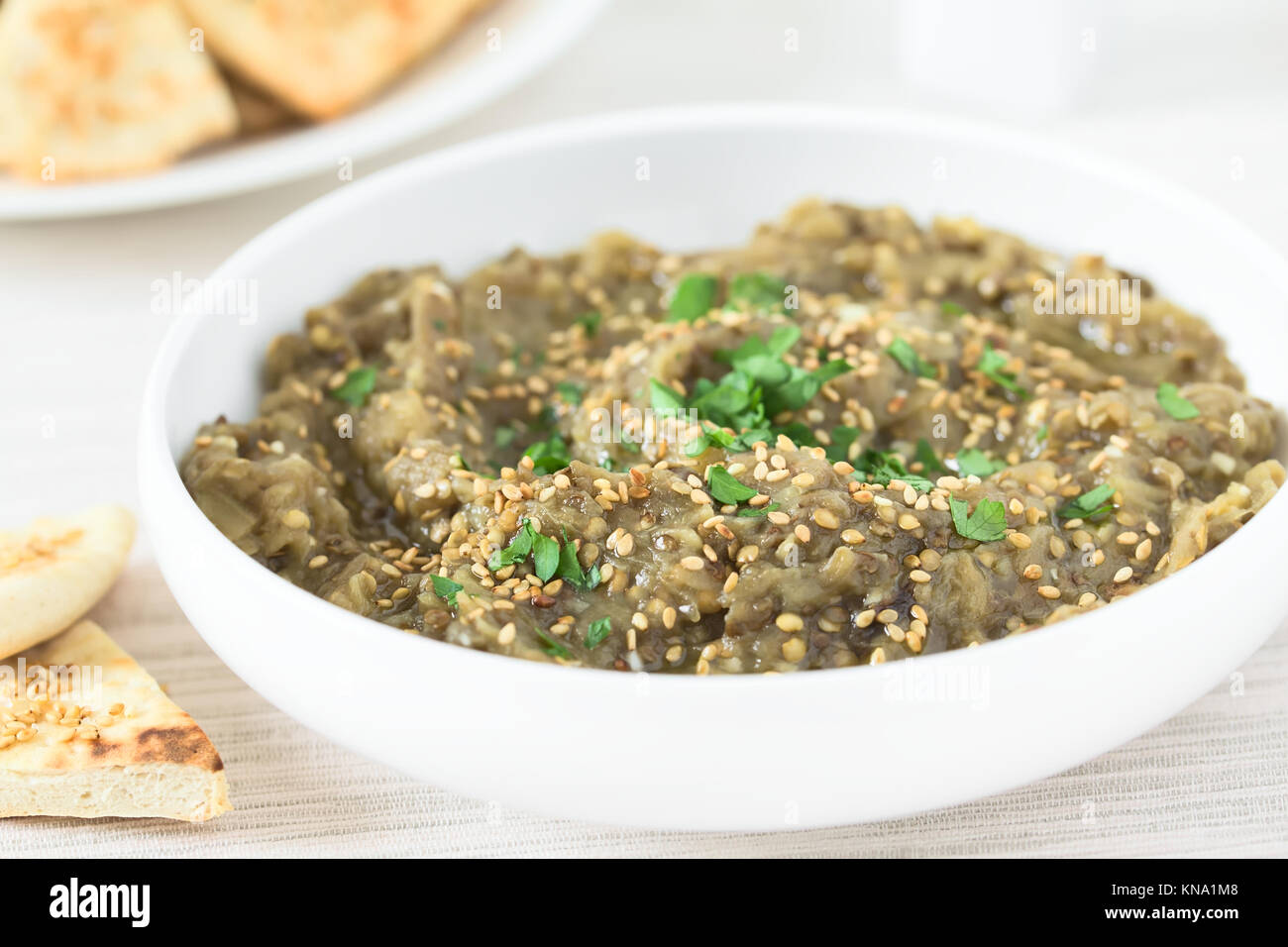 Homemade roasted eggplant dip or spread, baba ganoush in the Mediterranean cuisine, with olive