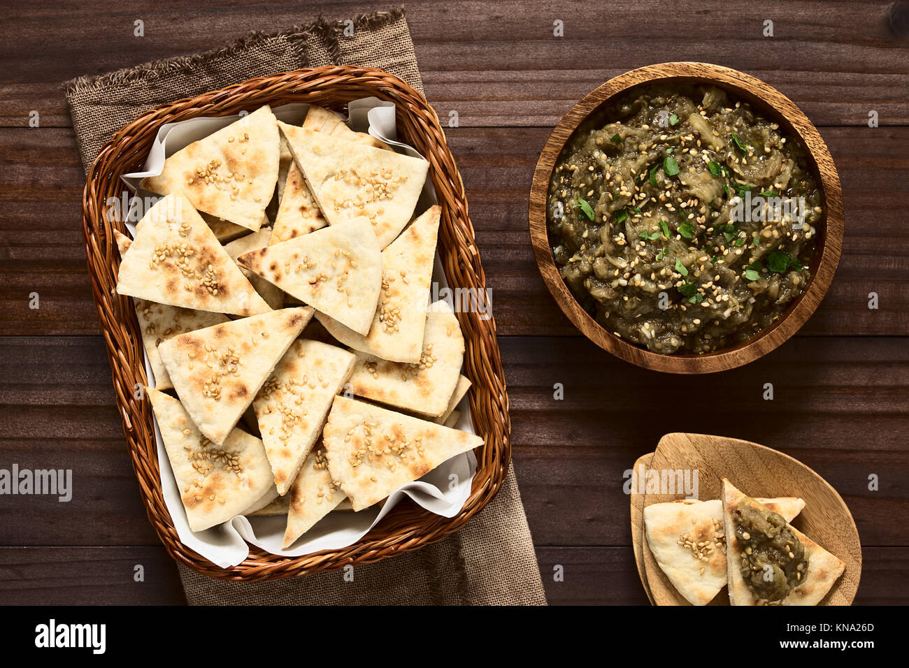 Homemade sesame pita chips with roasted eggplant dip or spread, baba