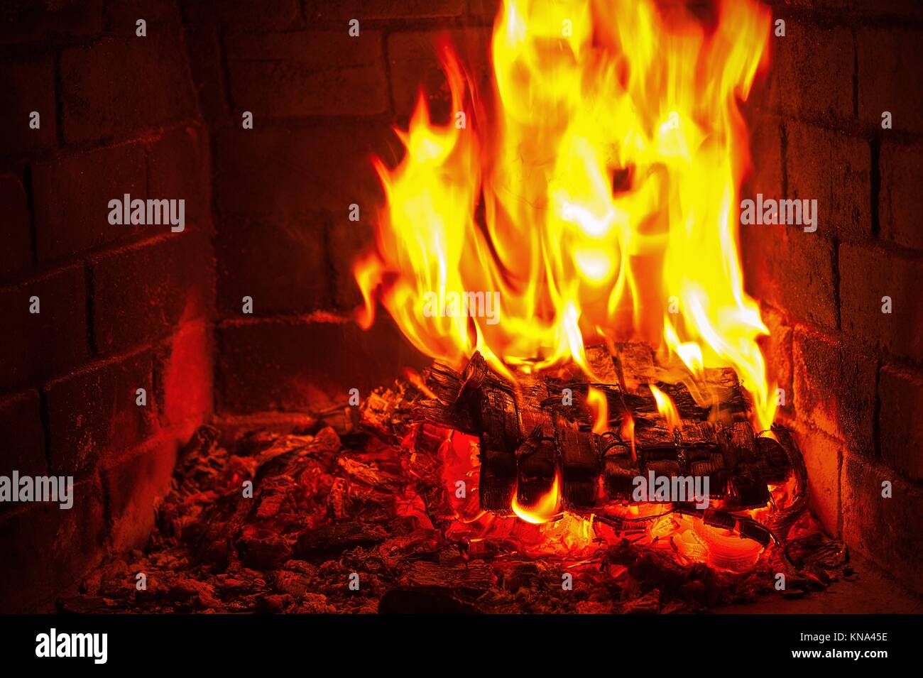 Burning and glowing pieces of wood in Fireplace Stock Photo - Alamy