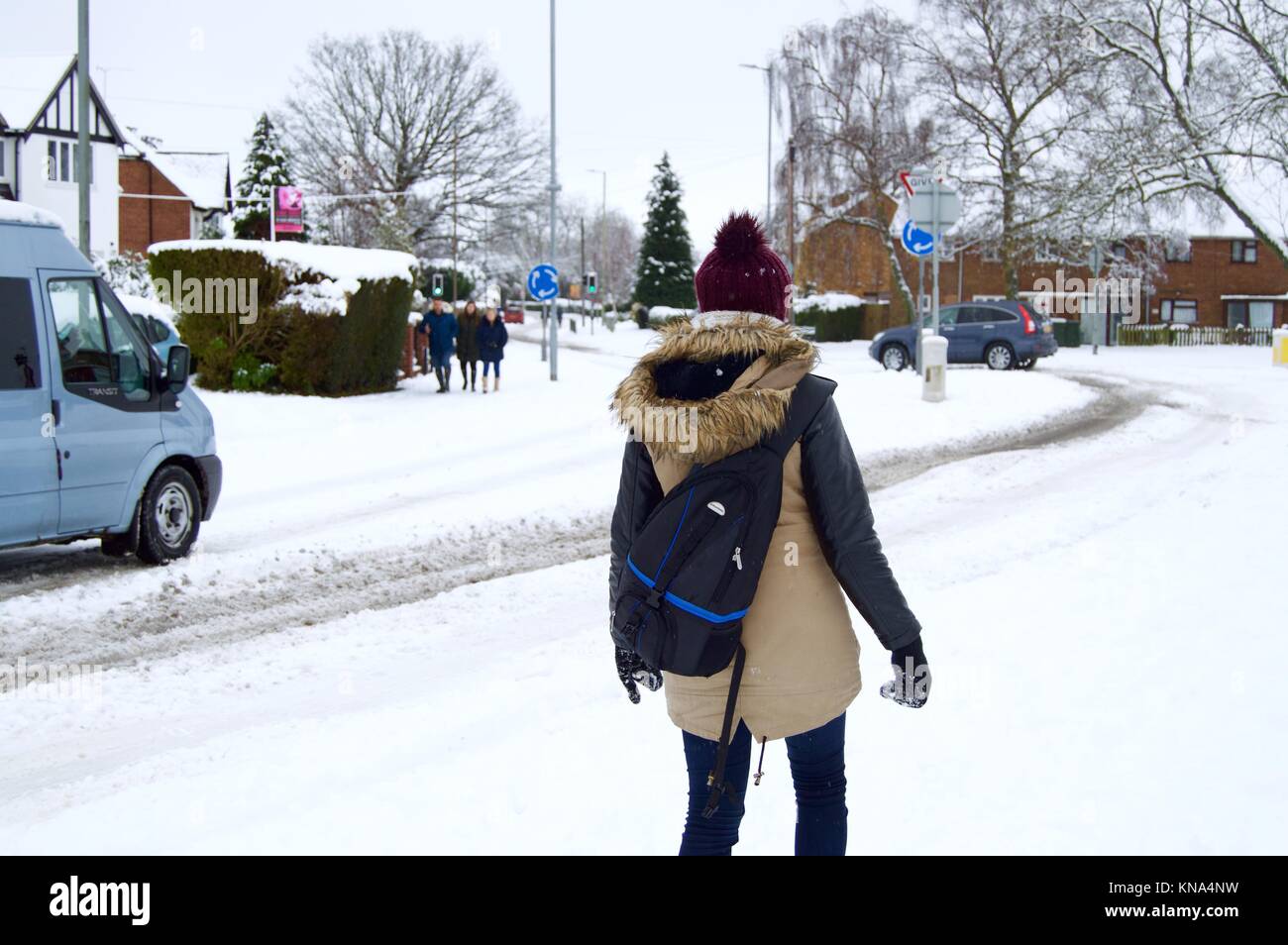 Woman walking in the snow after heavy snowfall in Hemel Hempstead