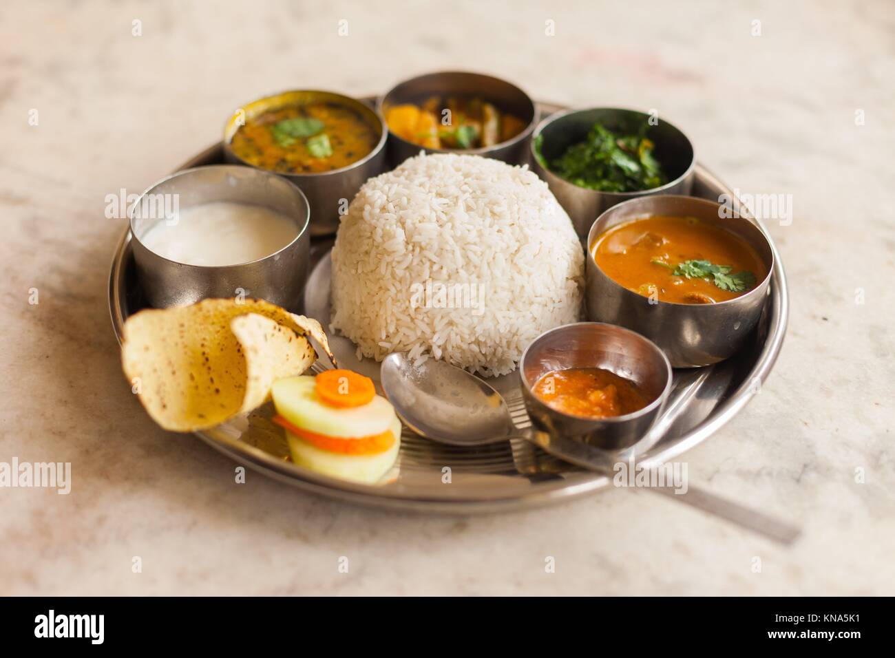 Vegetarian Nepali Thali (Dal Bhat) set, a traditional meal with rice and pulses in Nepal. Stock Photo